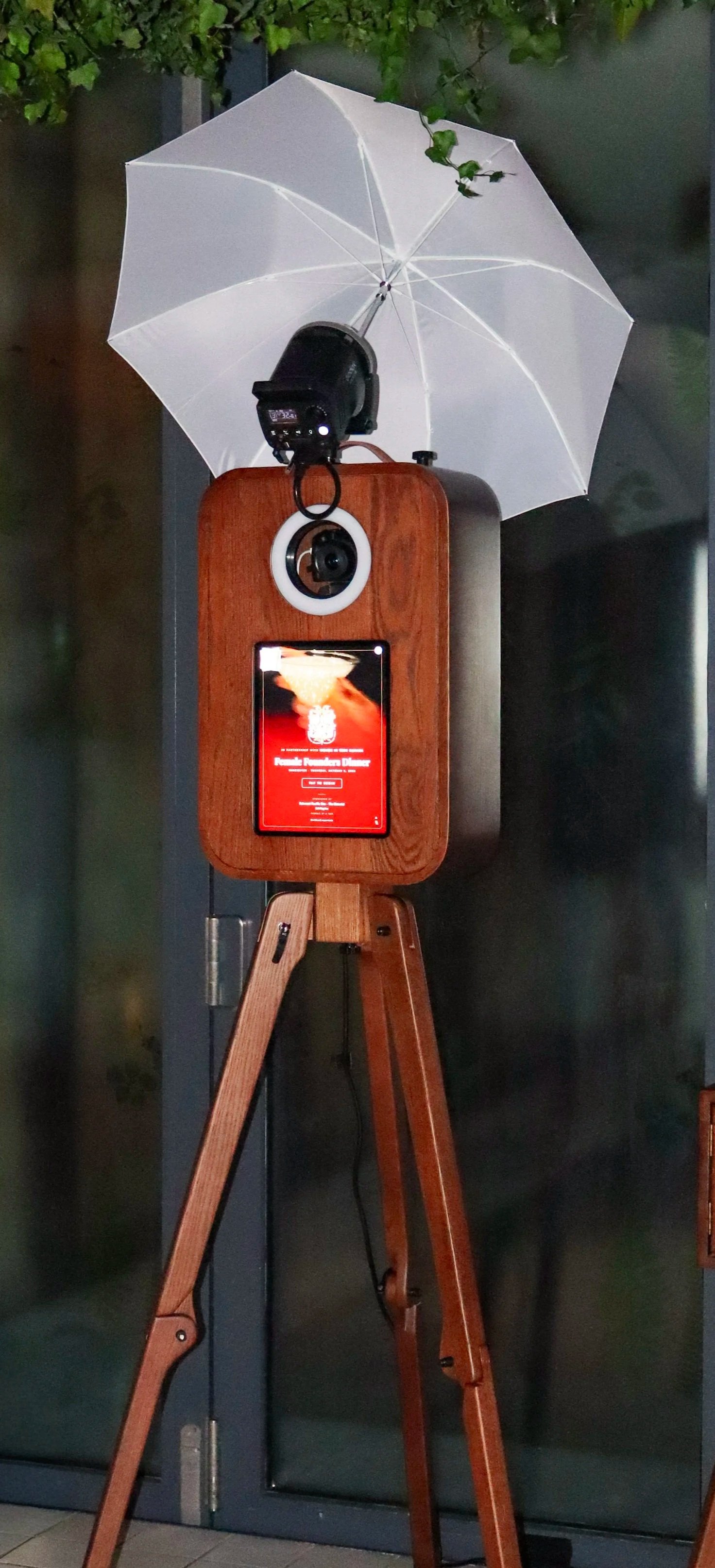a classy, elegant, dark wood photo booth at an event in Vancouver, British Columbia
