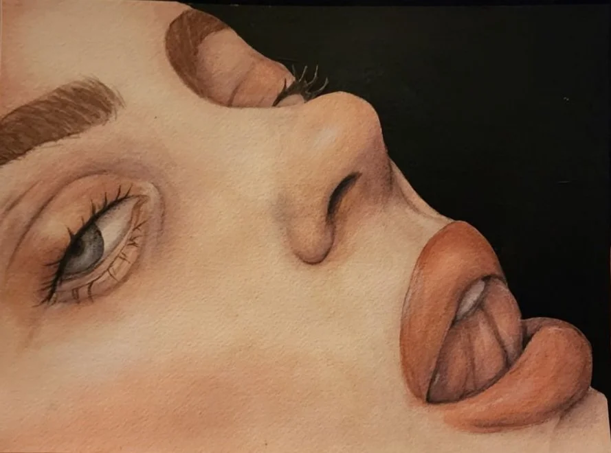 Close-up of a person's face with detailed makeup and an abstract, surreal depiction of lips and tongue.
