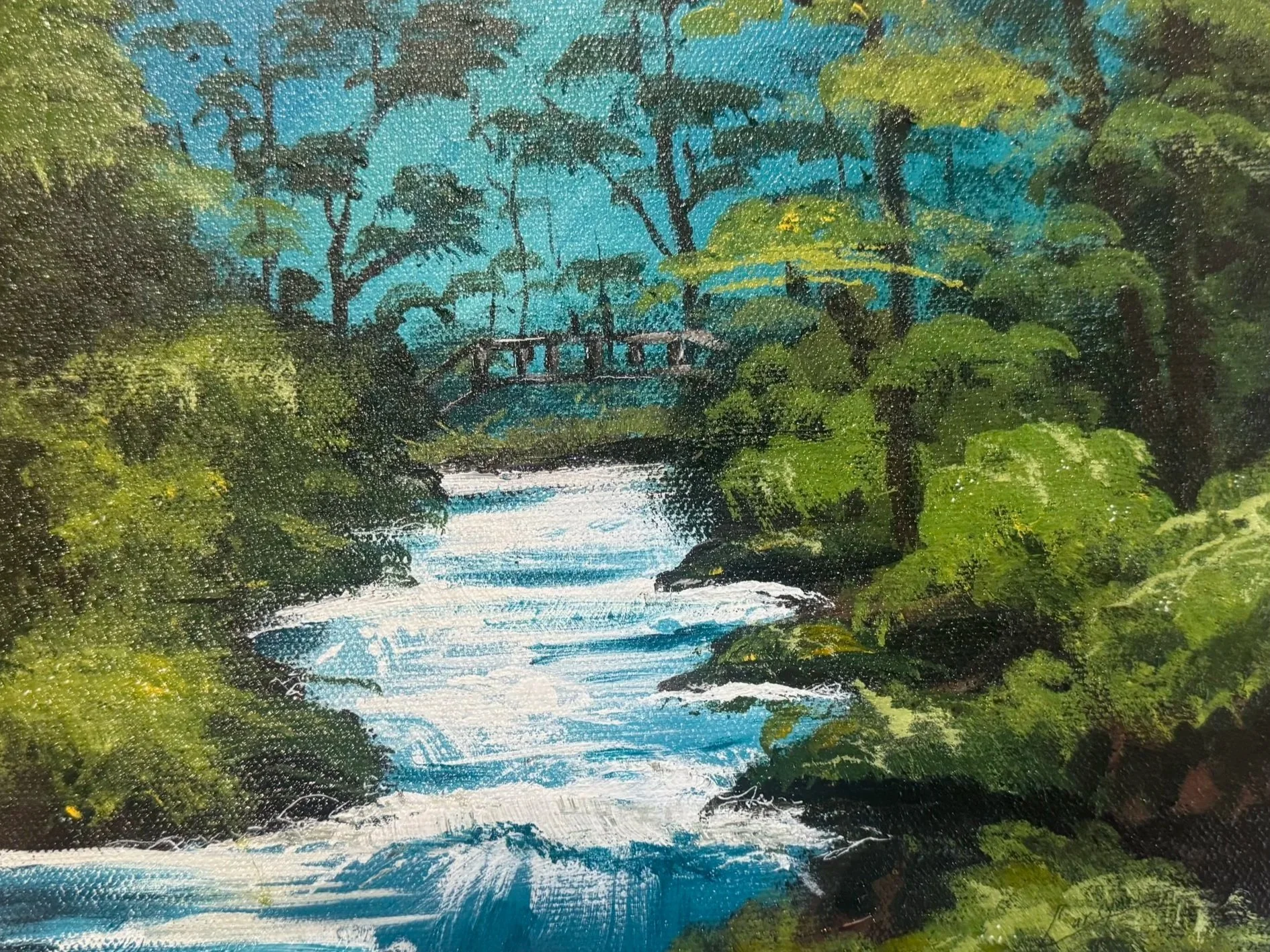 Painting of a lush green forest with a river flowing through it, a small wooden bridge crossing the river, and trees with thick green foliage under a blue sky.