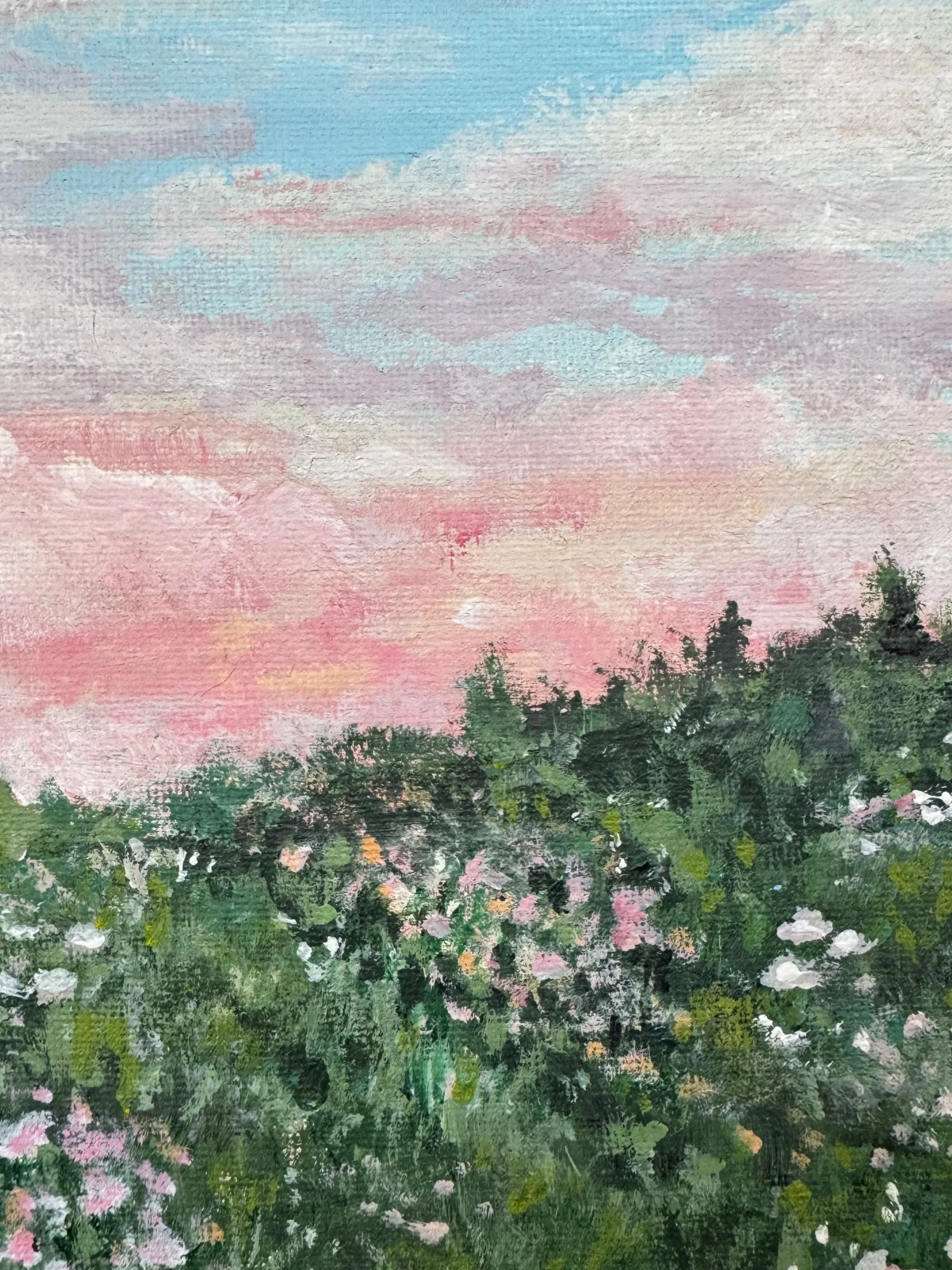 A colorful painting of a sunset or sunrise with pink, purple, blue, and green clouds and trees in the foreground.