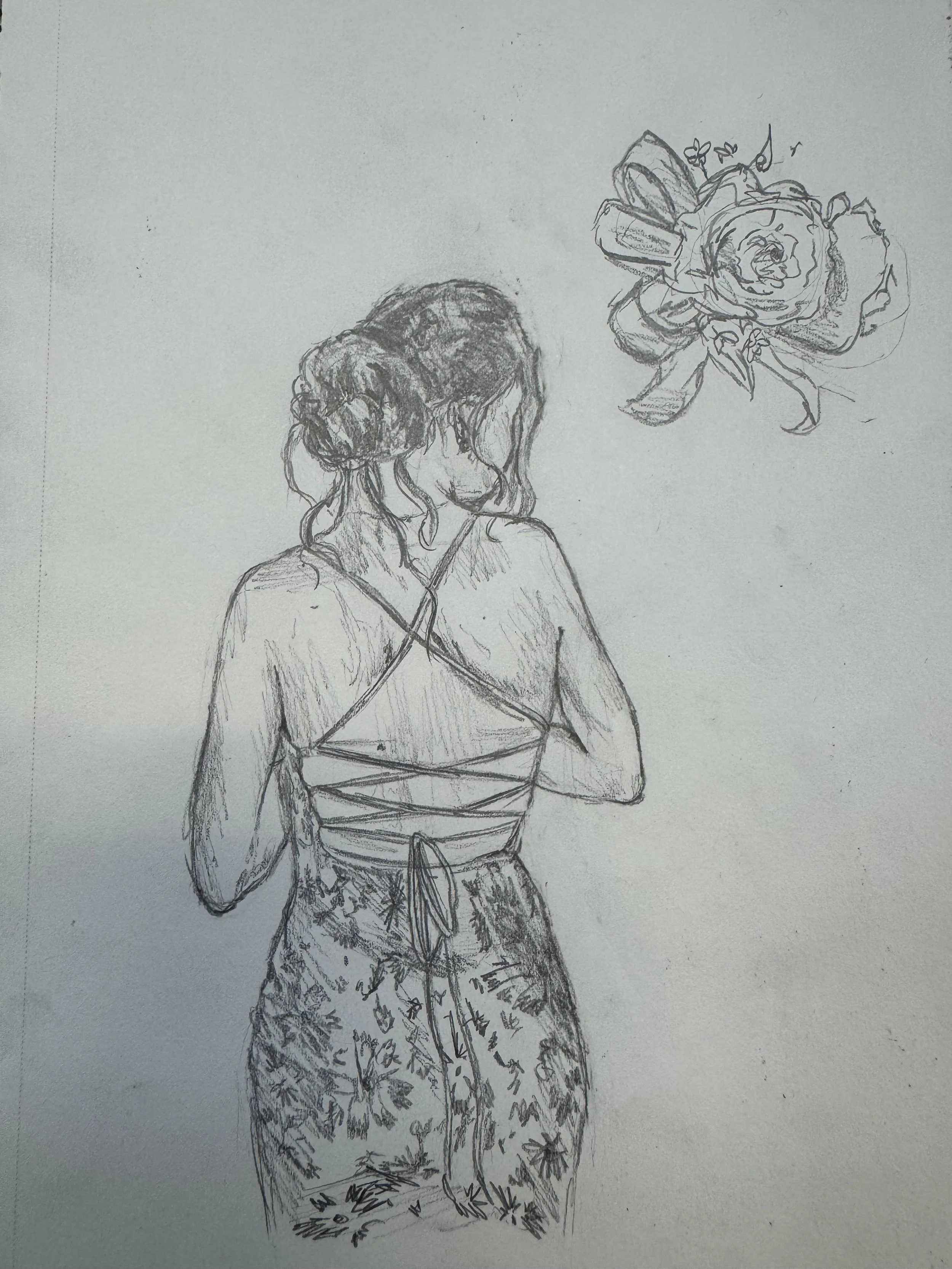 A pencil sketch of a woman with curly hair, wearing a top with crossed straps, and patterned pants. She is looking to the side with a pensive expression, and there is a detailed drawing of a large rose and butterfly near her head.