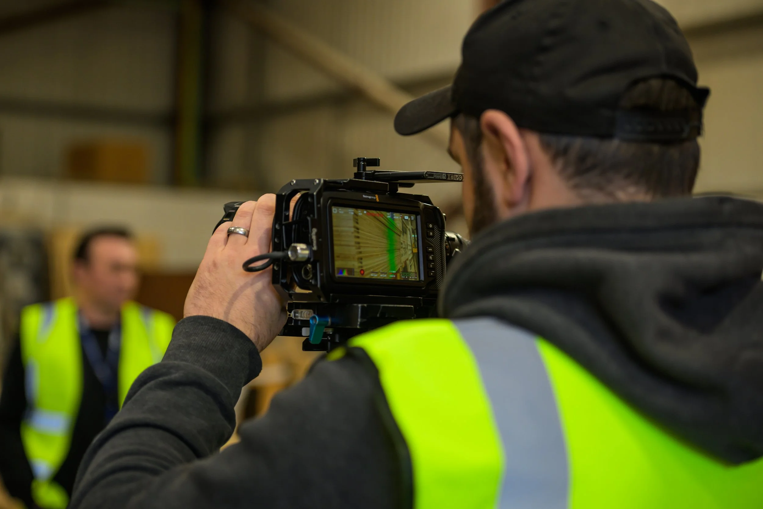 Farsight crew member filming wooden pallets inside the DSV Aberdeen warehouse.