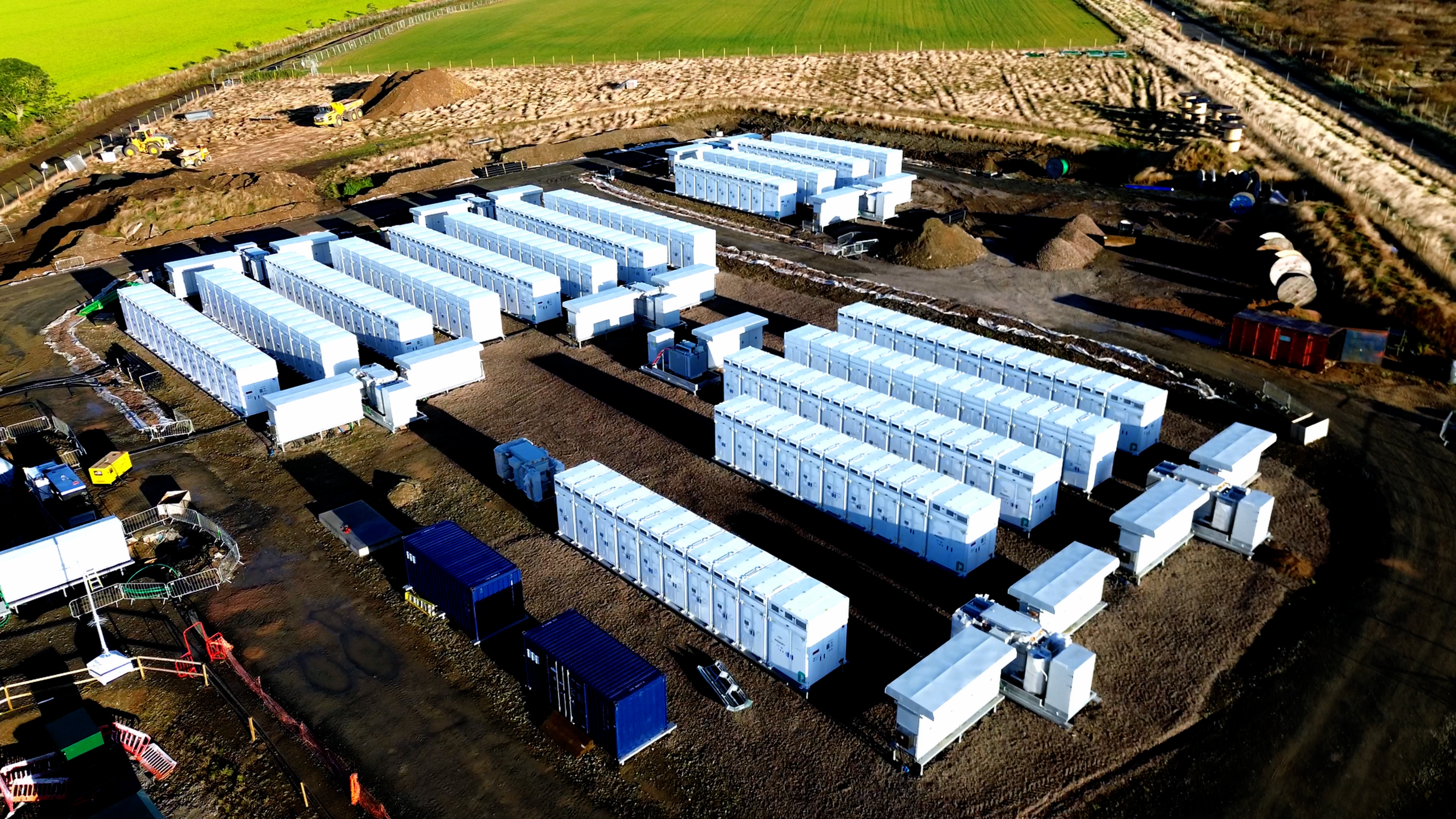 White Ener-G Services battery storage units positioned at an industrial site.