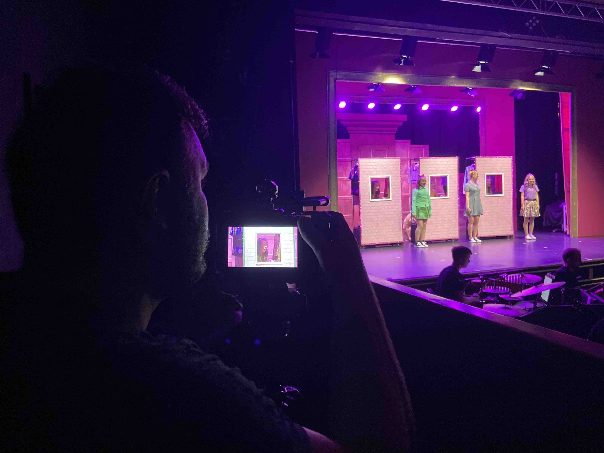 Farsight crew member recording a live stage performance at Aberdeen Arts Centre.