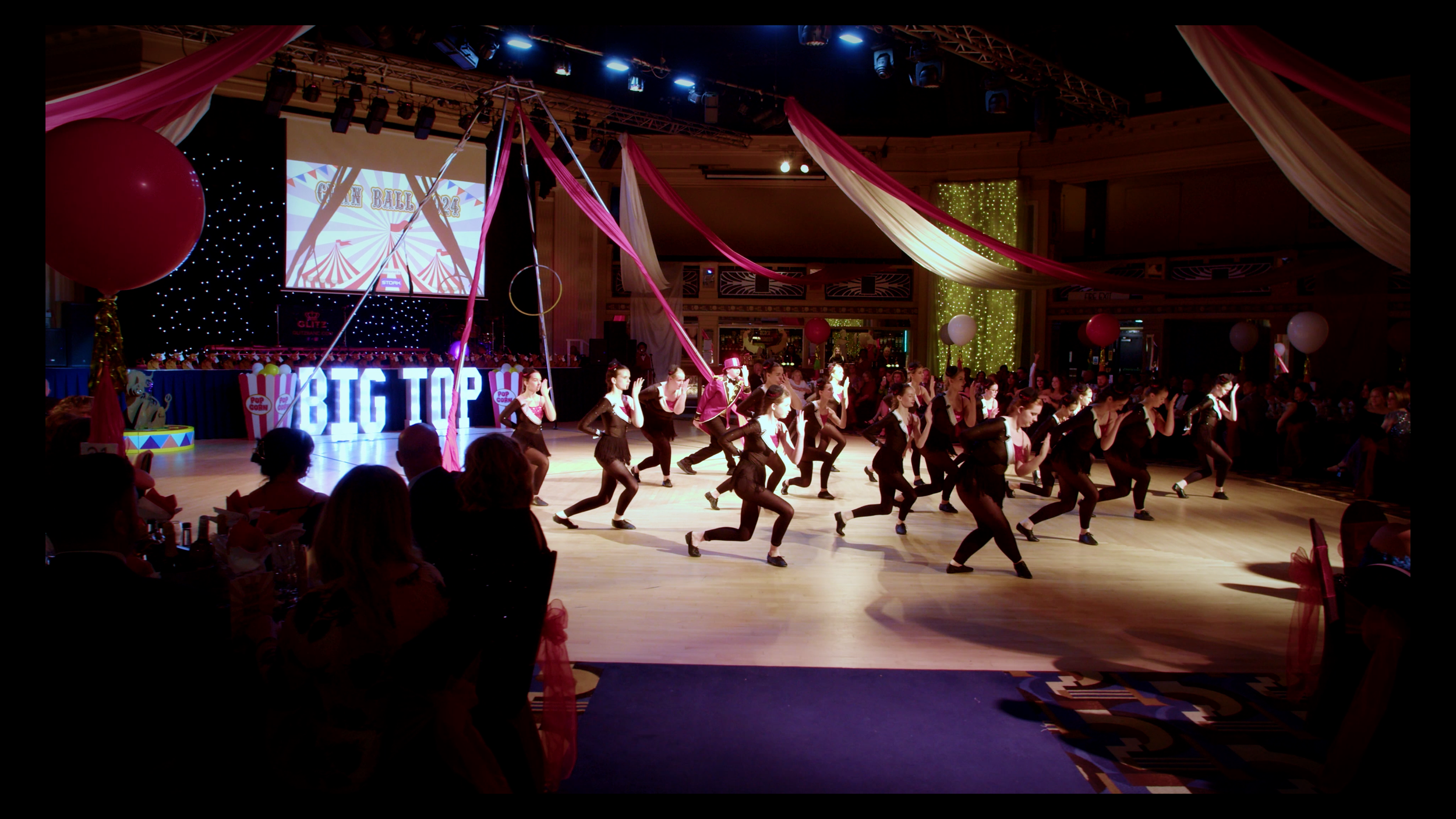 Dancers performing on stage at the CLAN Cancer Support annual ball.