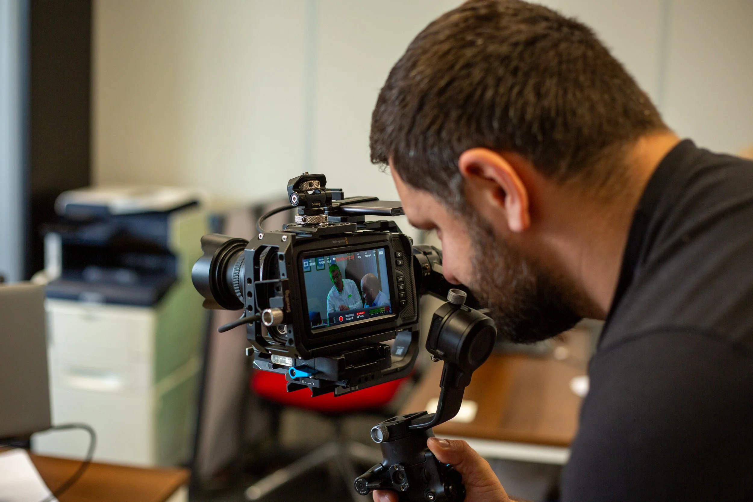 Farsight crew member filming the QHSE Aberdeen team inside their office.