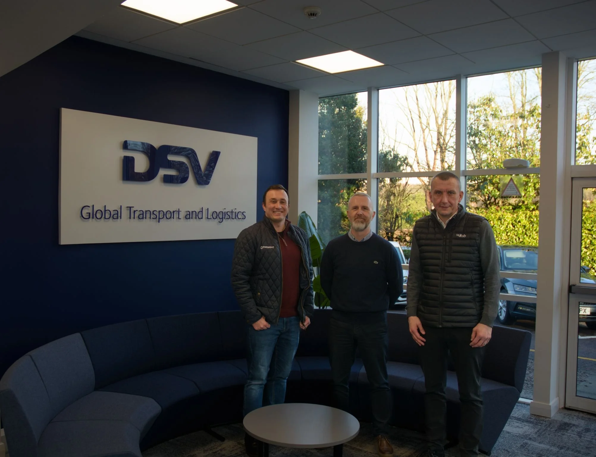 Michael Silva of Farsight with Bruce and Alan from the DSV Aberdeen management team beside the DSV sign.