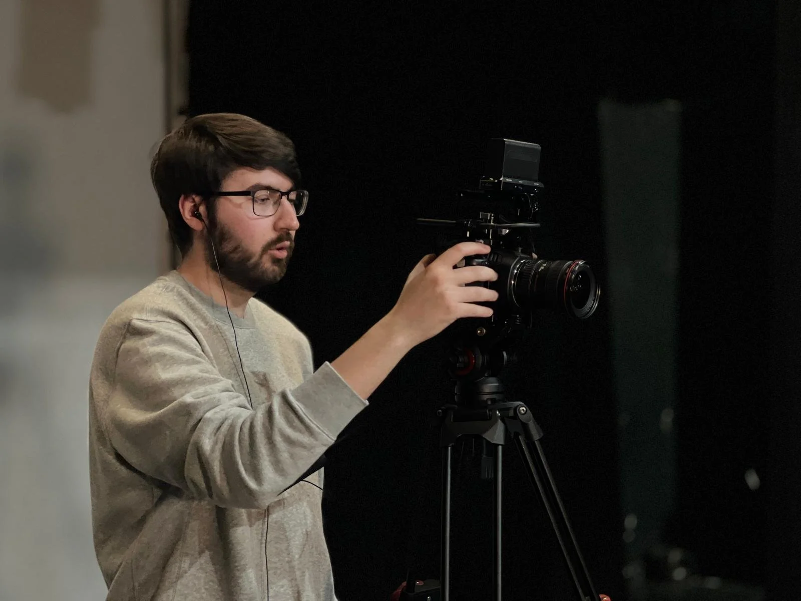 Callum operating a camera during filming at Aberdeen Arts Centre.