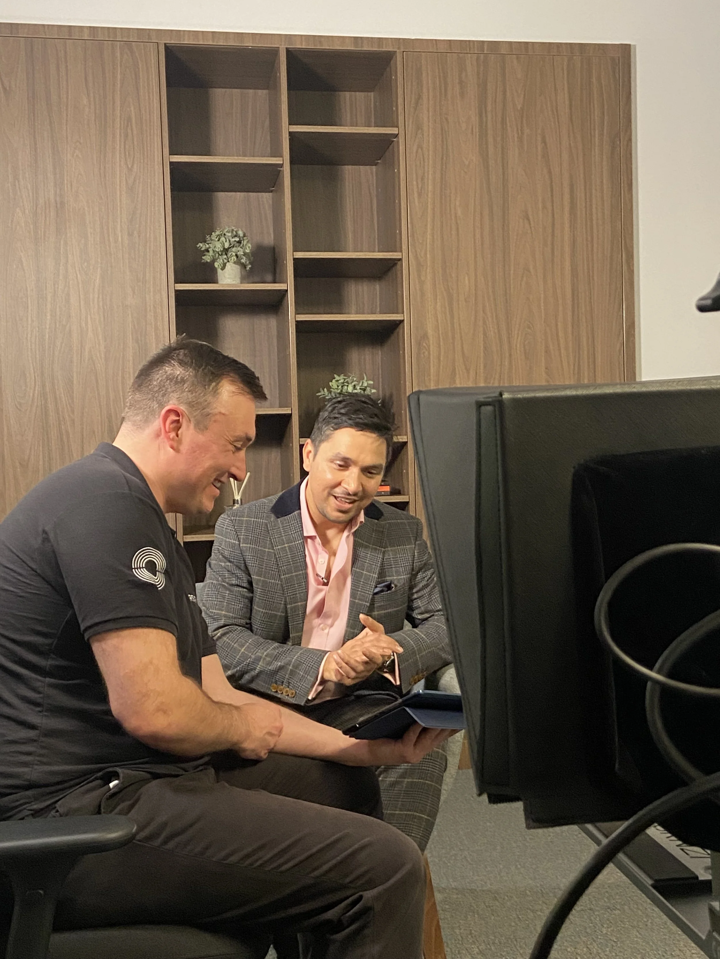 Michael Silva reviewing a script with a client during a Farsight filming session.