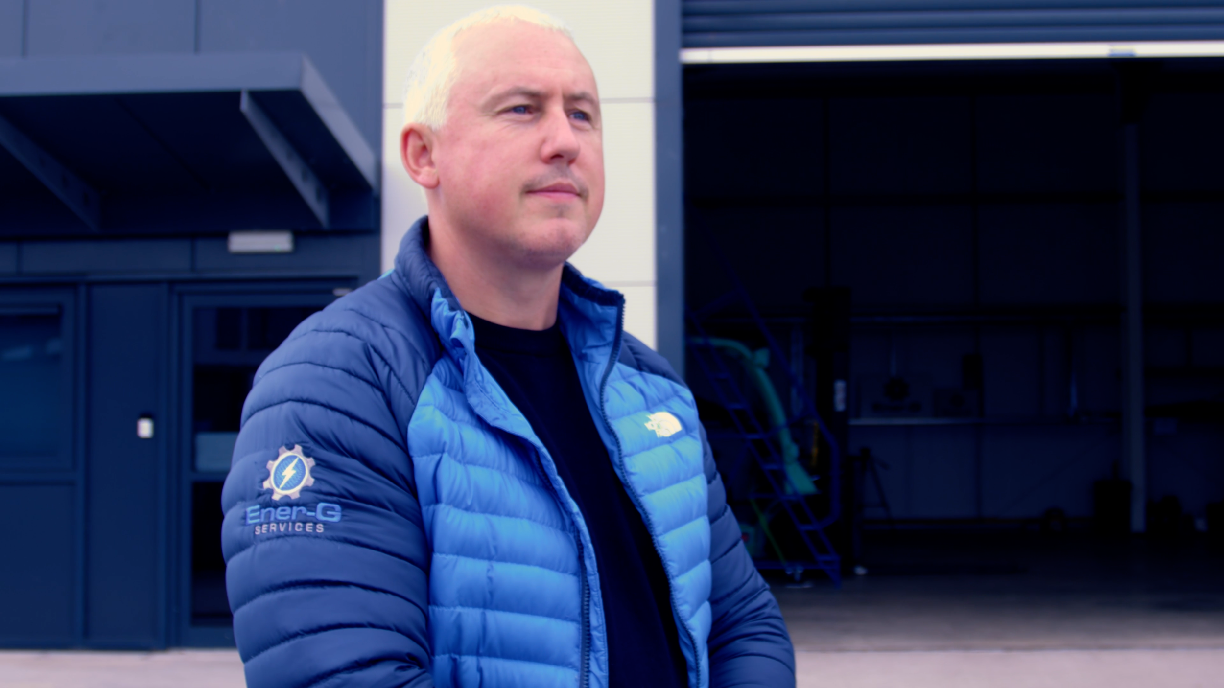 Graeme Harper, owner of Ener-G Services, standing outside the company building.