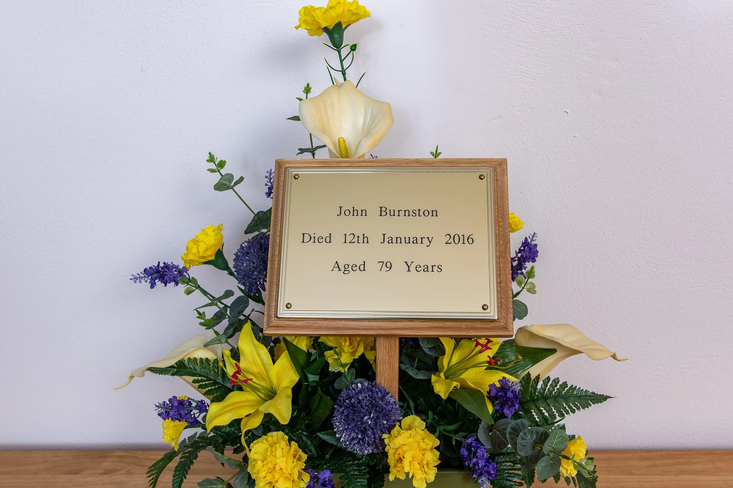 In-house engraved coffin plate and grave marker.