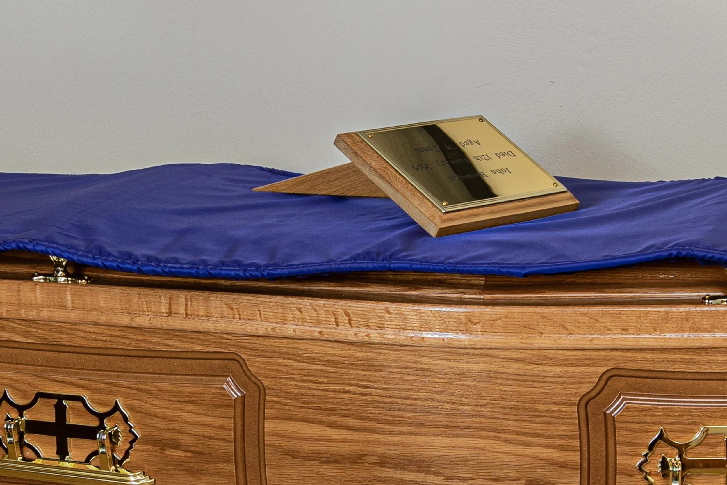 All raised lid panel side coffins come with engraved grave marker and padded coffin cover (to avoid damage while filling in the grave).