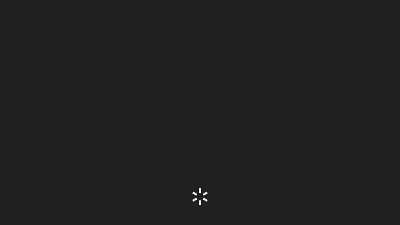 Dark, blurred background with a centered loading spinner