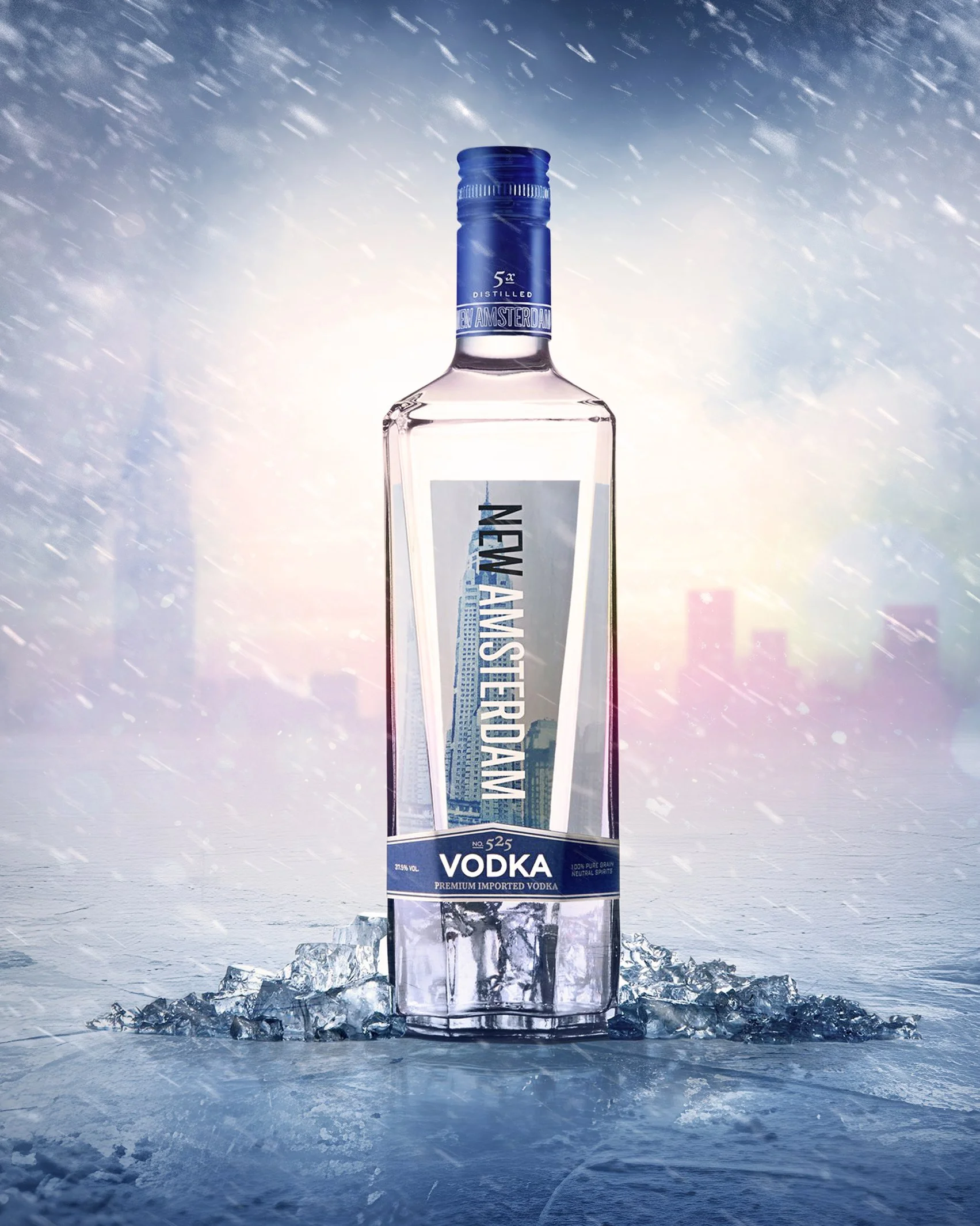 A bottle of New Amsterdam vodka standing on an icy surface with a background of snow and falling snowflakes.