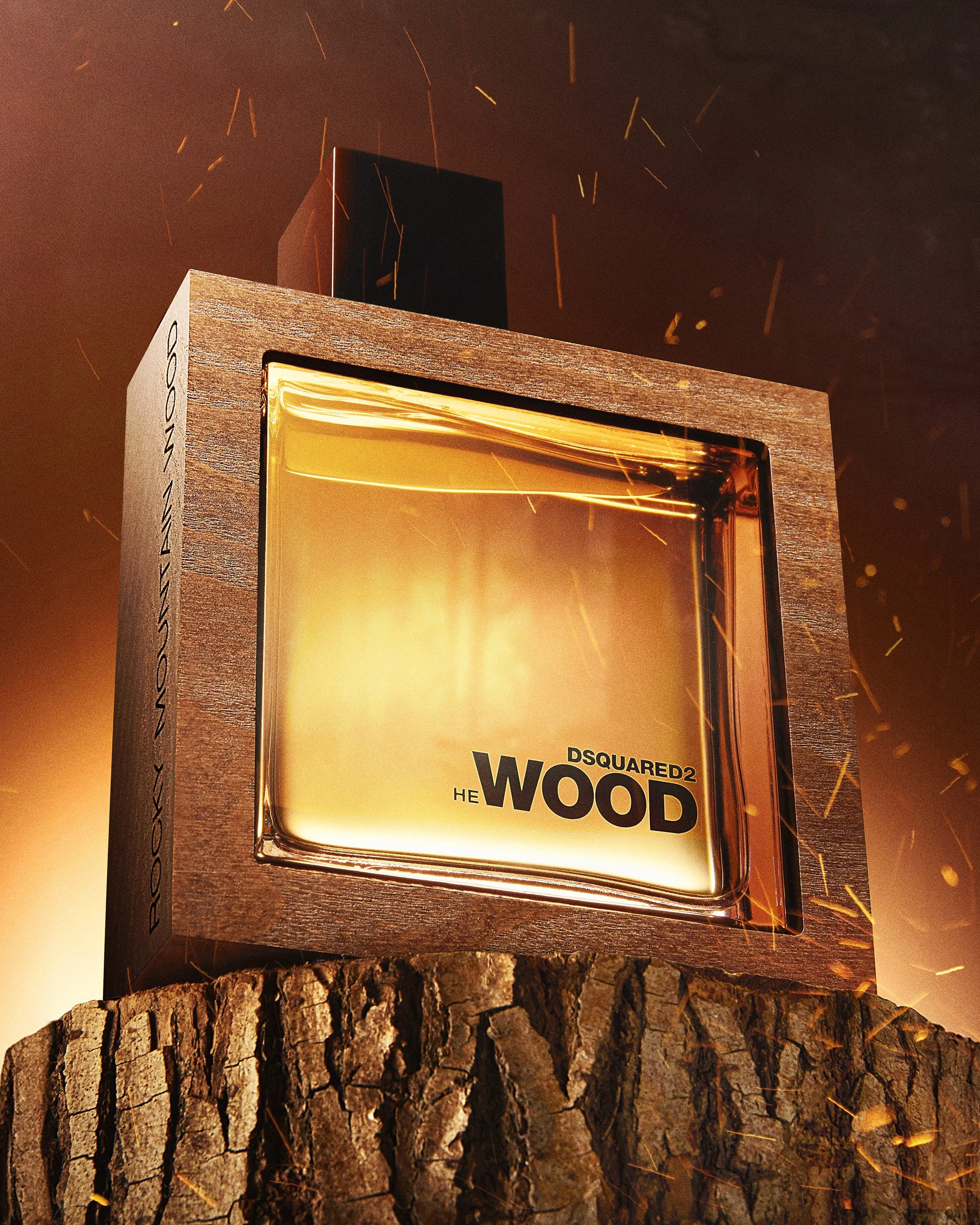 Close-up of a lit wood-themed perfume box with fiery sparks and glowing light in the background.
