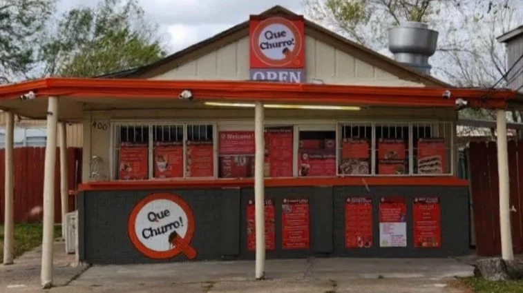 The Que Churro walk-up stand located at 400 S Oscar Williams Rd in San Benito, TX, right across from San Benito High School.