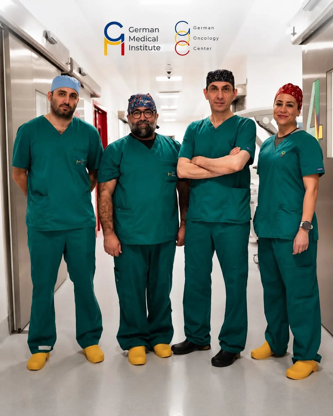 Four medical professionals in green scrubs and yellow shoe covers standing in a hospital corridor, with the German Medical Institute logo and German Oncology Center logo above them.