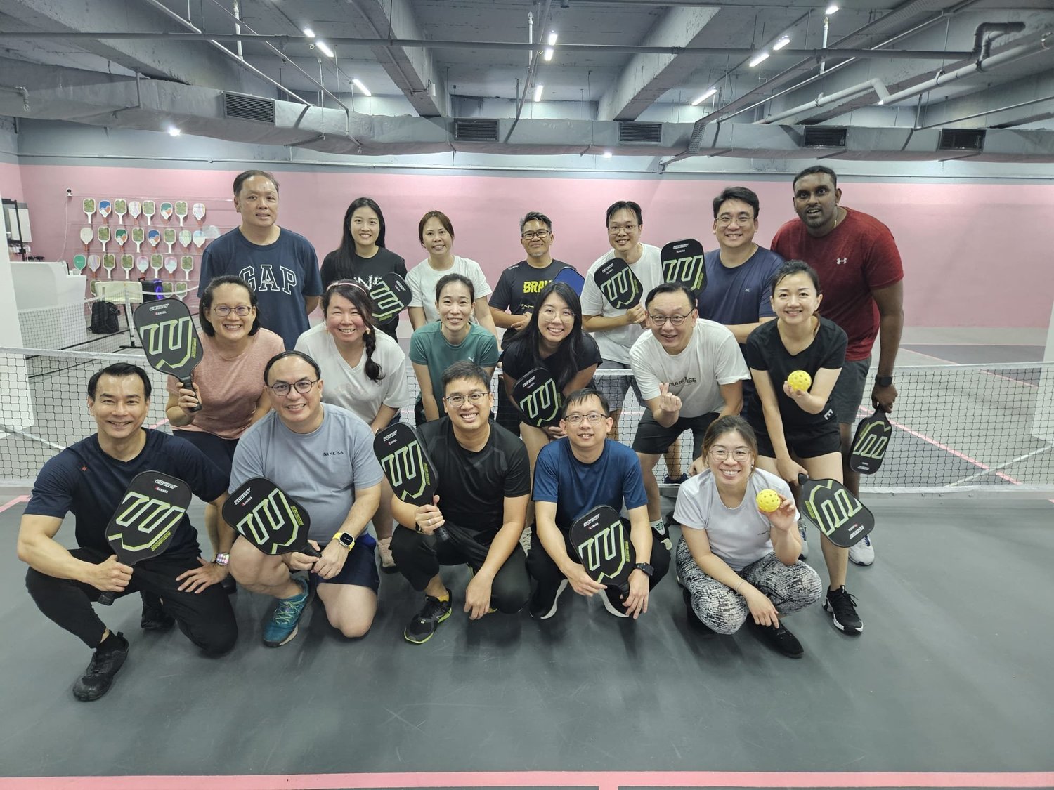Corporate pickleball team-building workshop on air-conditioned indoor courts at Play! Ball Serangoon