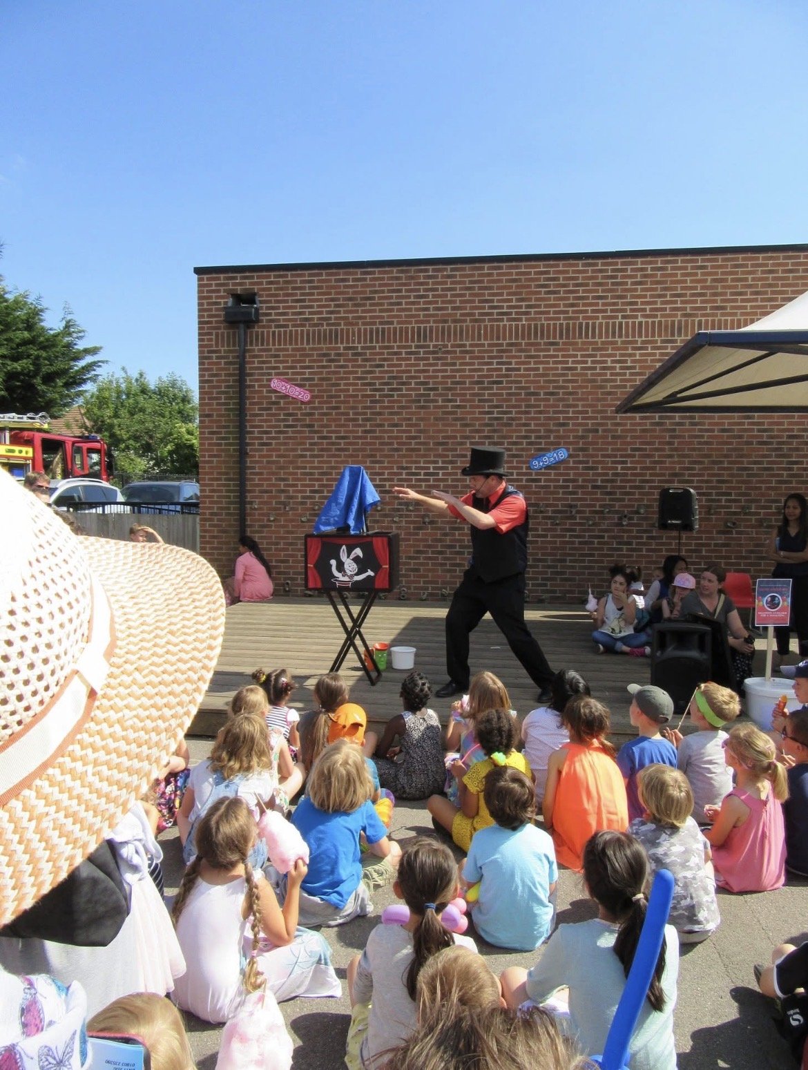 magician entertaining children at a party