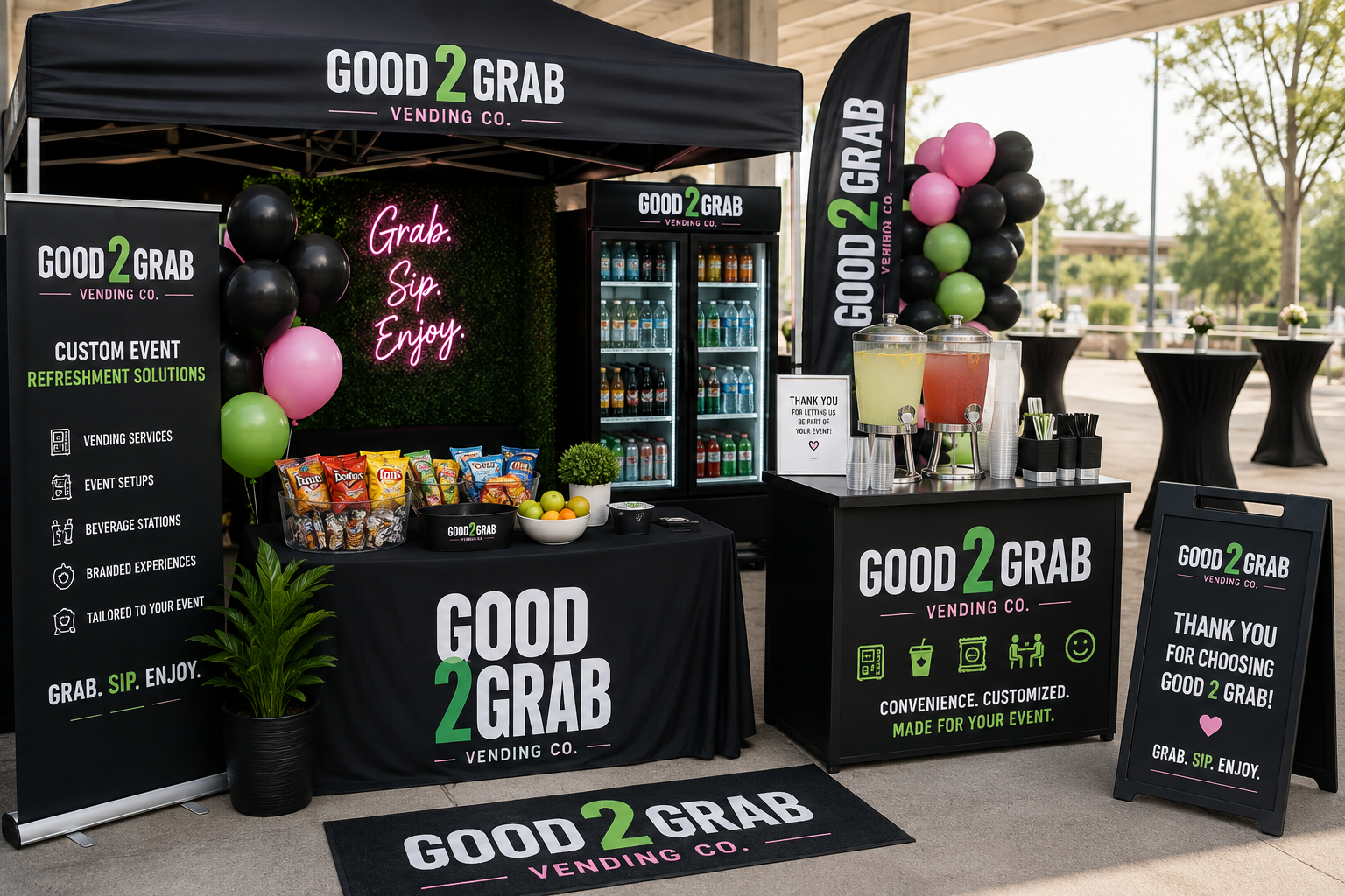 A vending station set up outdoors featuring a black canopy with the 'Good 2 Grab Vending Co.' logo, decorated with black, pink, and green balloons. The station offers cold beverages in a refrigerator, snacks, and water dispensers. There are informational signs, a potted plant, and a black tablecloth with the company's branding, promoting convenience and customized event services.