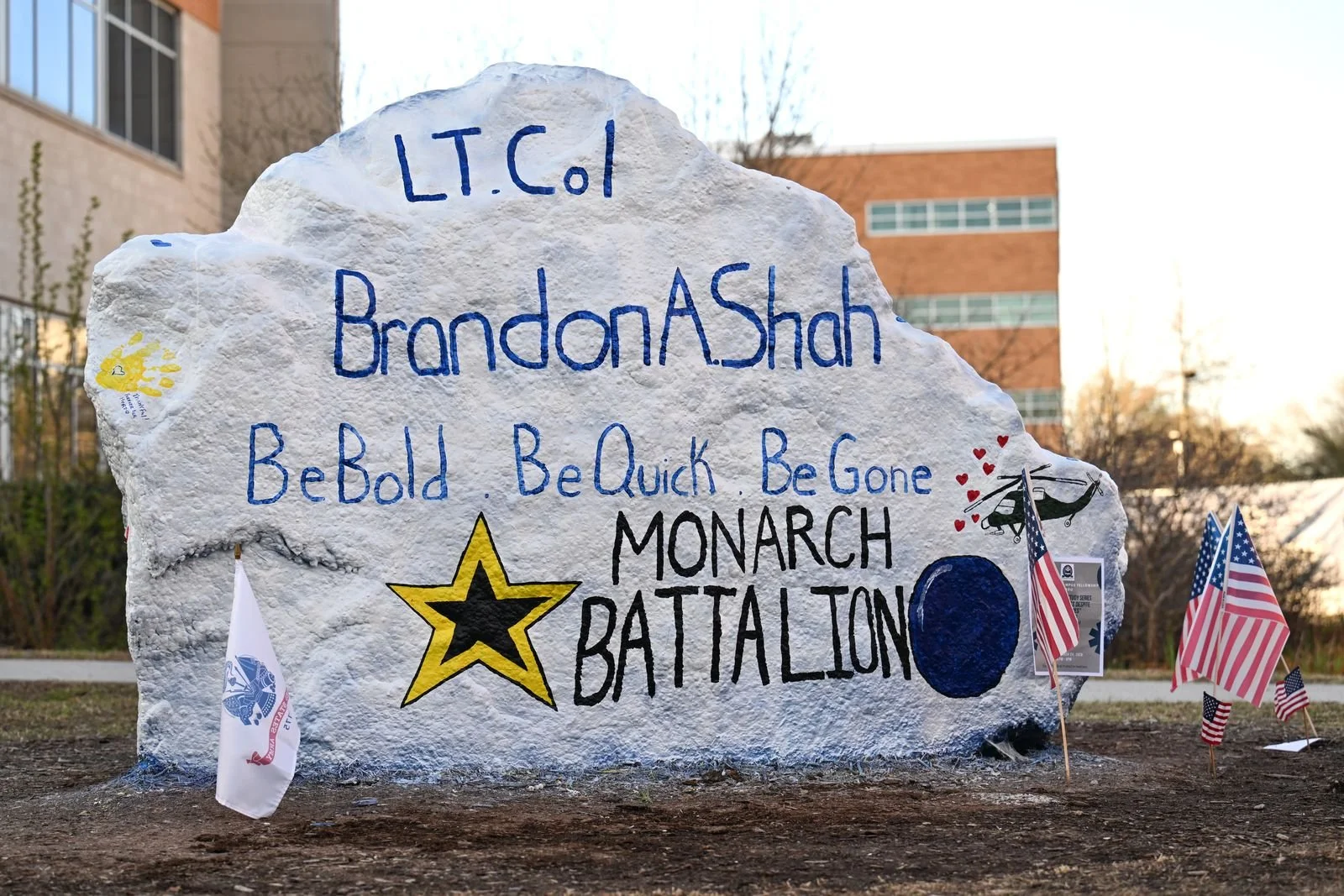 Painted tribute to LTC Brandon A. Shah with Monarch Battalion messages and American flags.