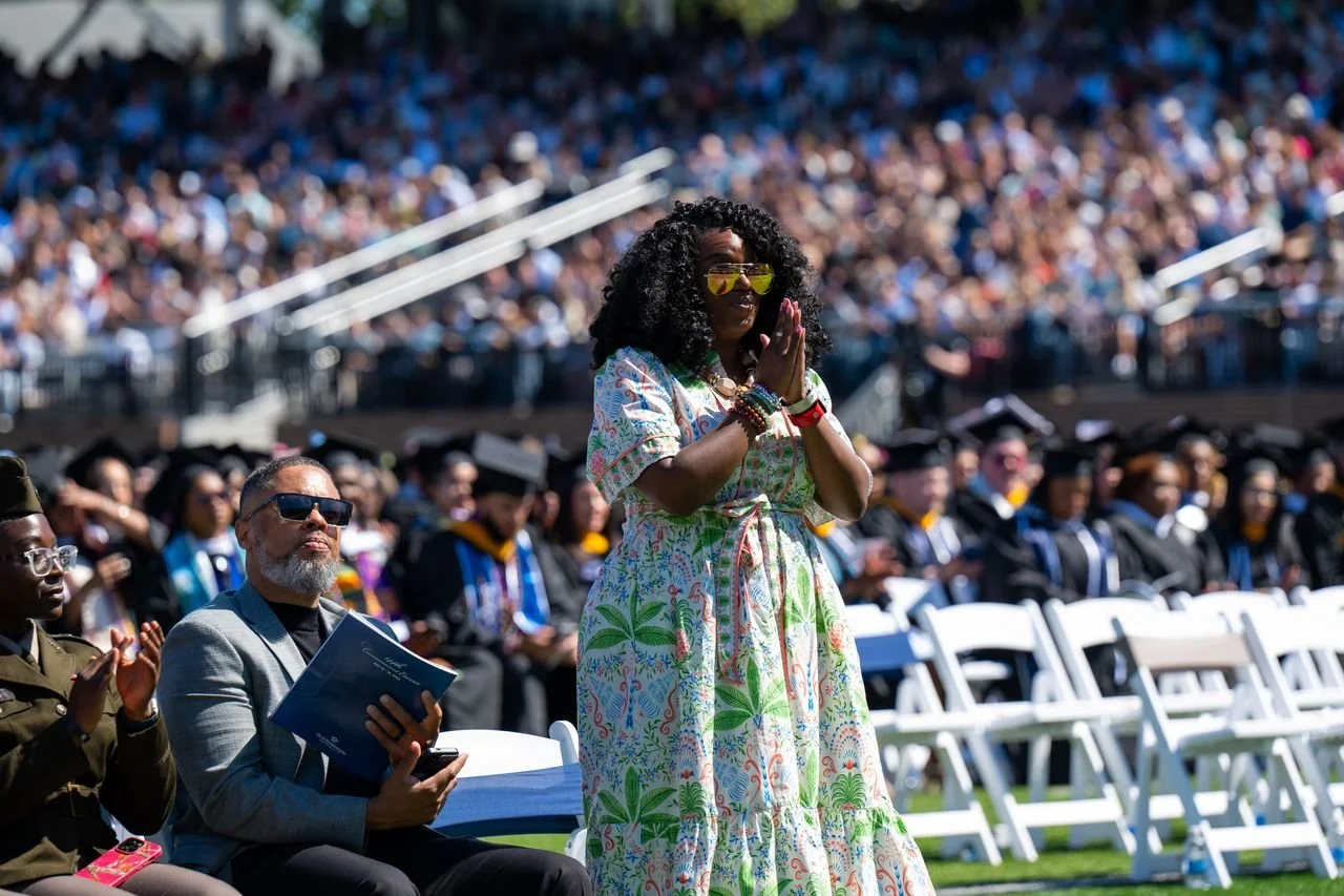 Speaker addressing graduates during an outdoor Old Dominion University commencement ceremony.