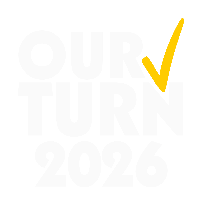 Logo in the top center reads "Our Turn 2026" in white font with a yellow checkmark.