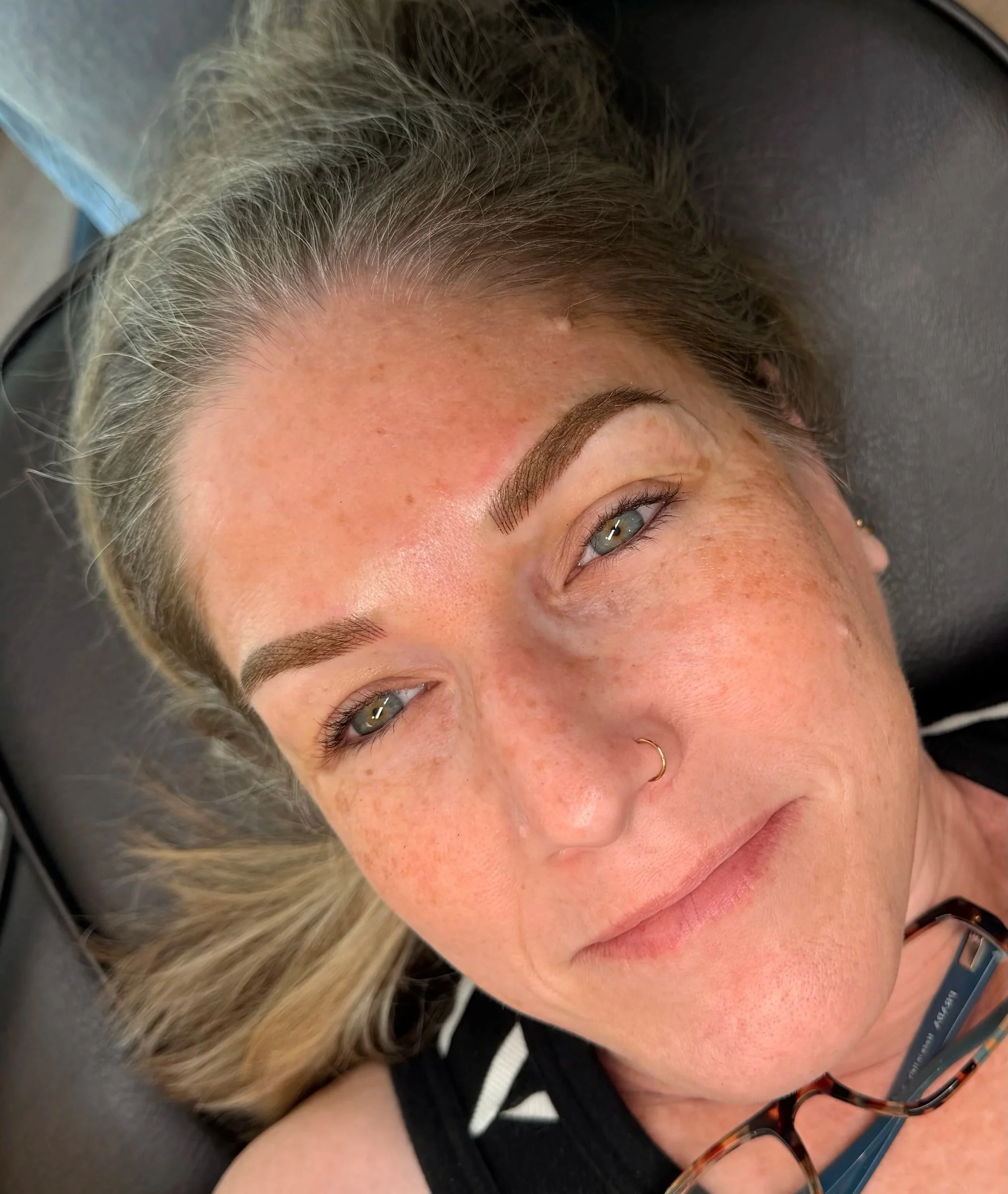 Close-up of client directly after brow appointment.