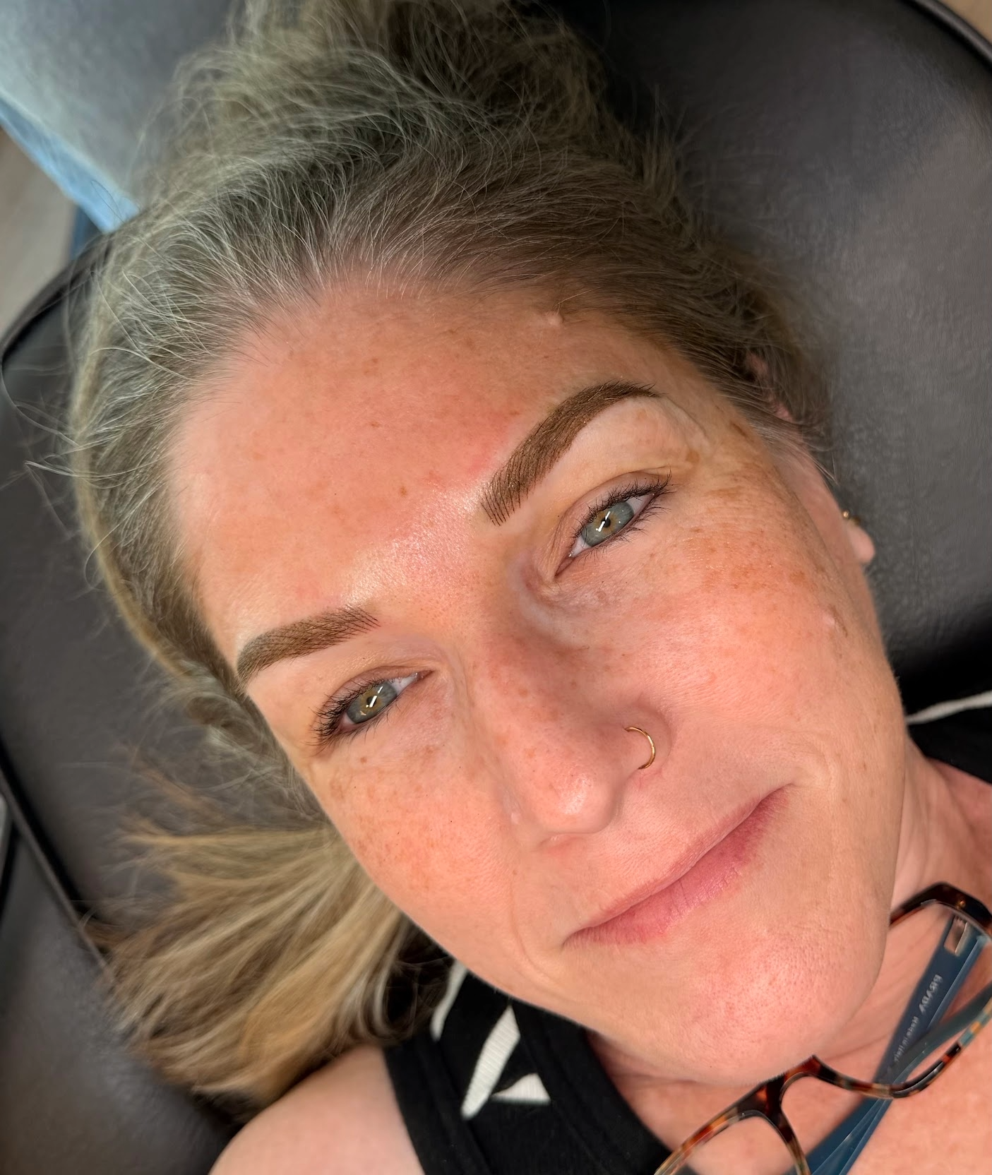 Close-up of client directly after brow appointment.