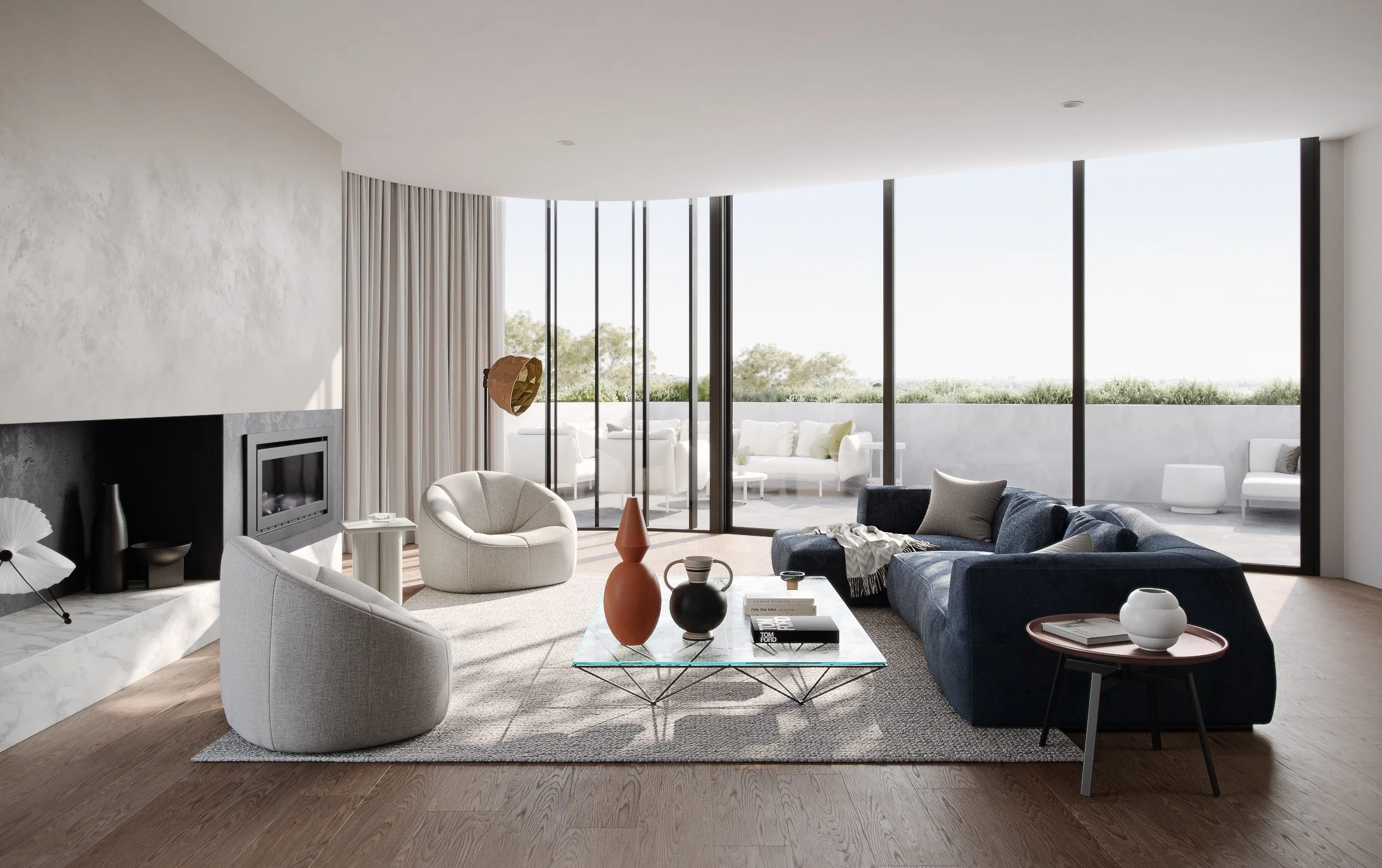 Modern living room with large floor-to-ceiling windows, a grey sofa, white armchair, black fireplace, and coffee table with decorative vases.
