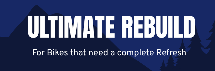 Dark blue background with mountains and trees, text reads "Ultimate Rebuild" and "For Bikes that need a complete Refresh".