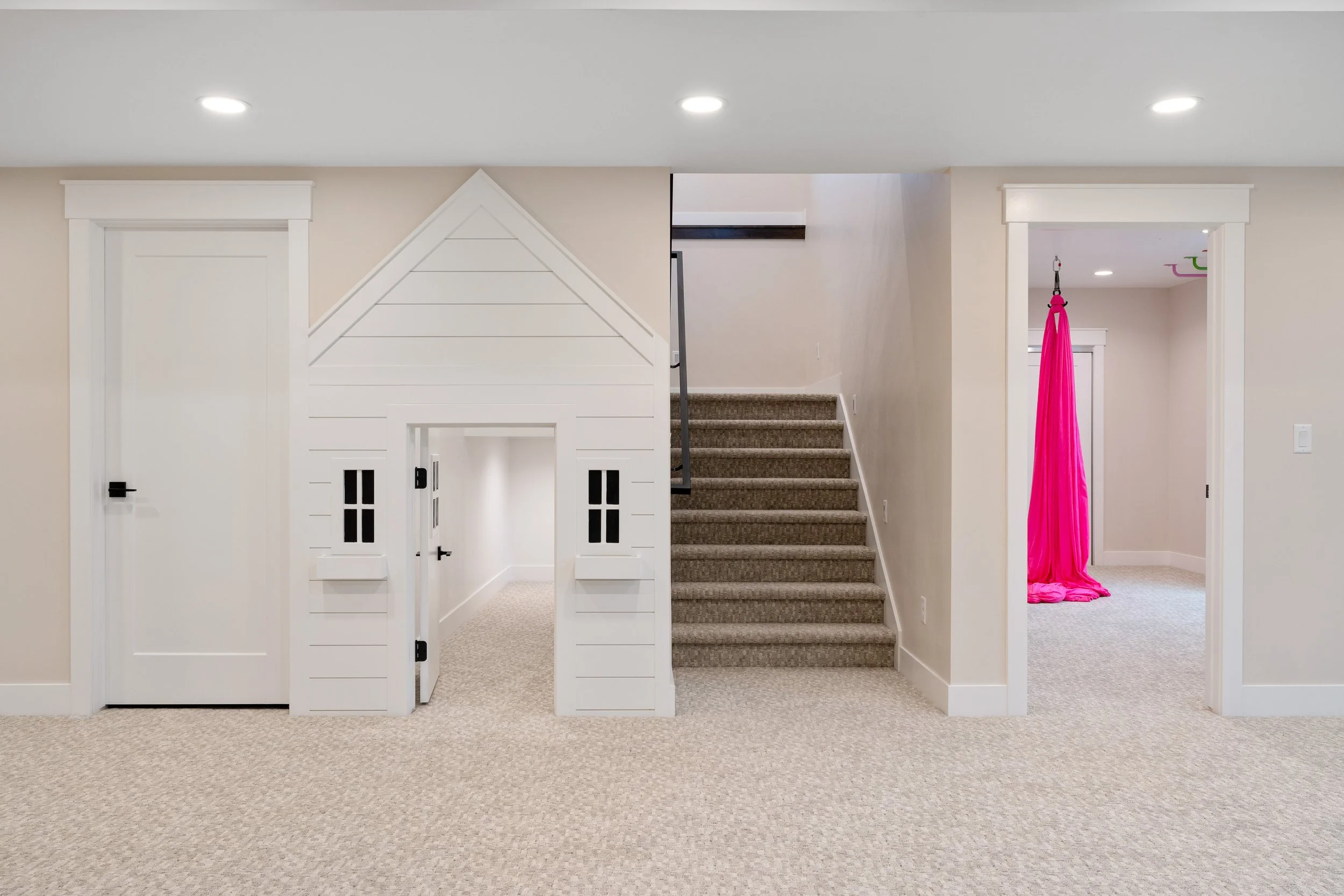 Basement playhouse beside the staircase — JAB Construction’s Timeless Craftsman custom home in Iona, Idaho.
