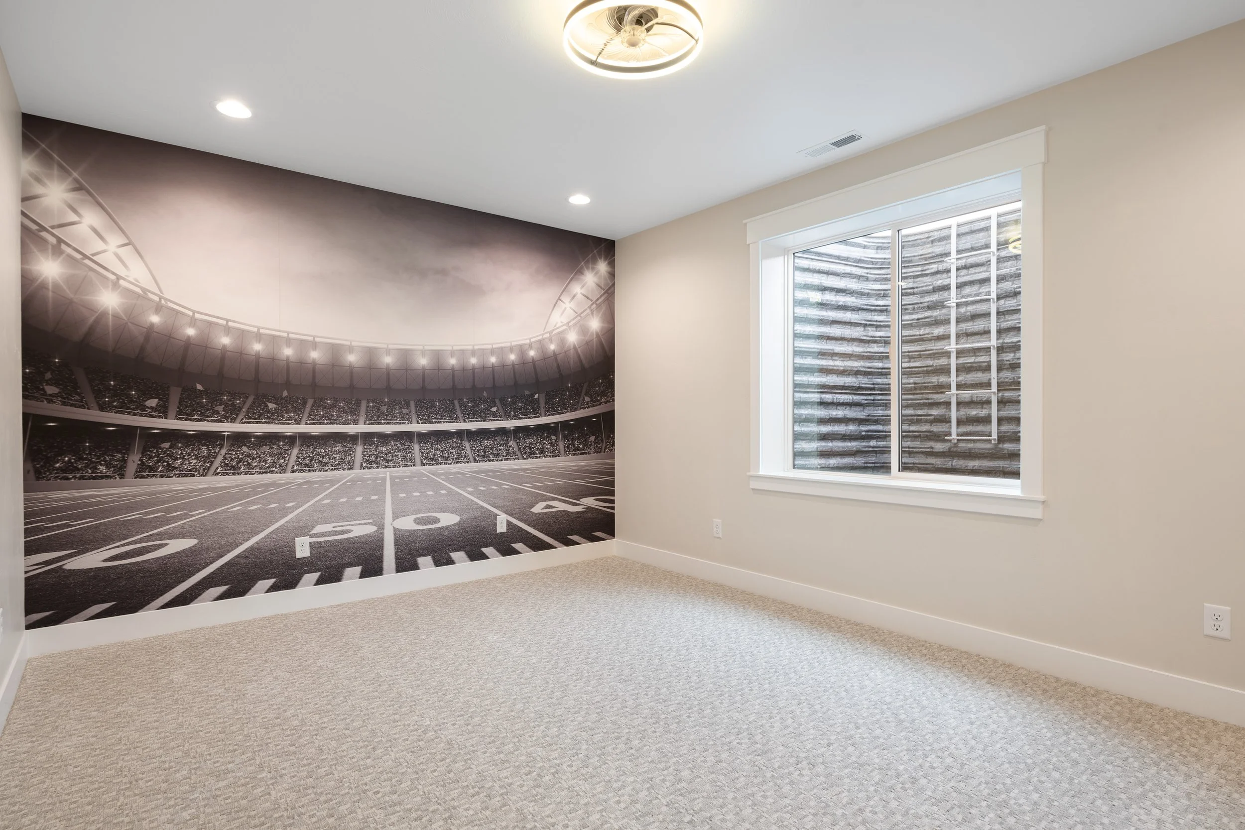Bedroom with a dark feature wall and window blinds — JAB Construction’s Timeless Craftsman custom home in Iona, Idaho.