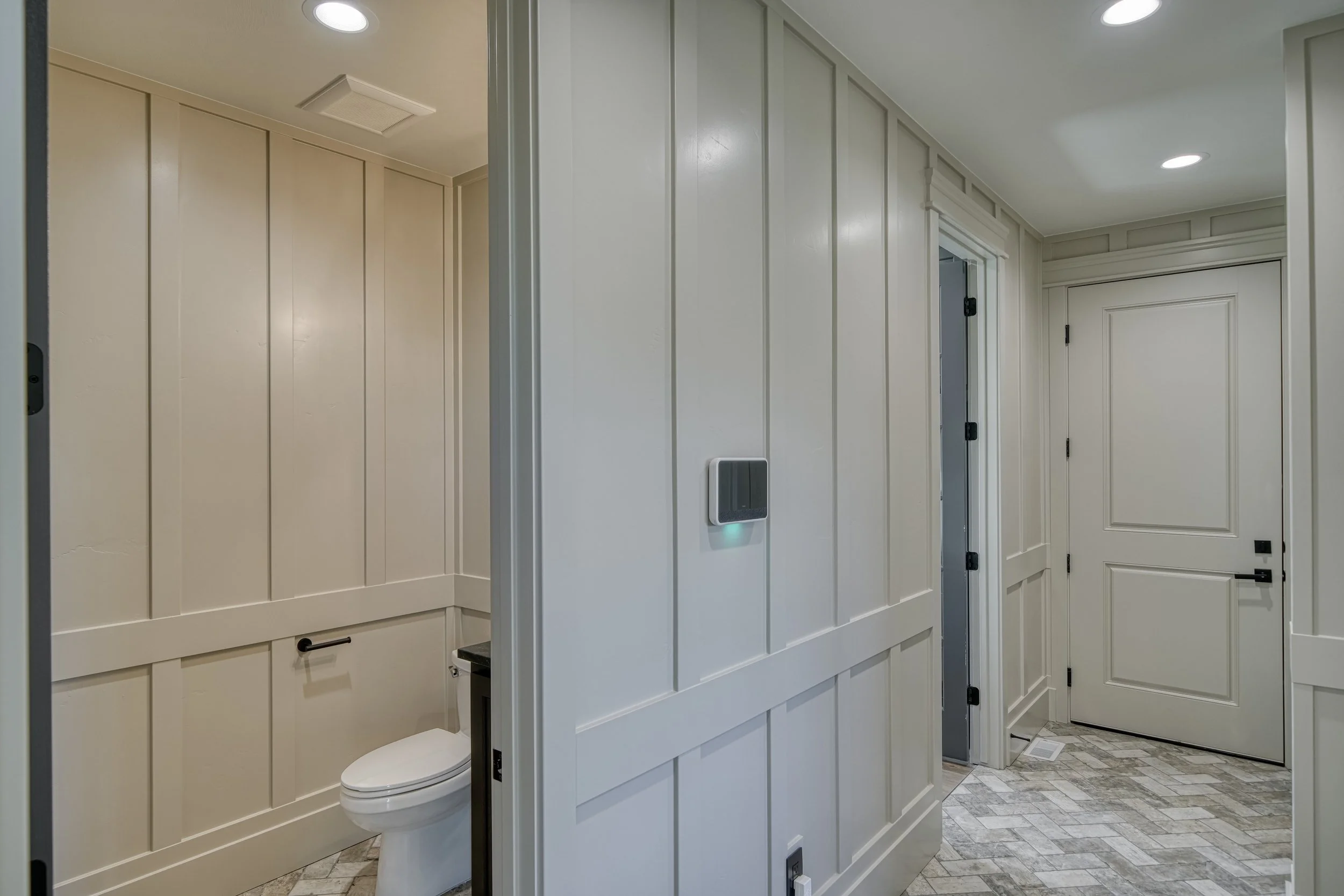 Entry storage area with paneled cabinetry — JAB Construction’s Modern Transitional custom home in Blackfoot, Idaho.