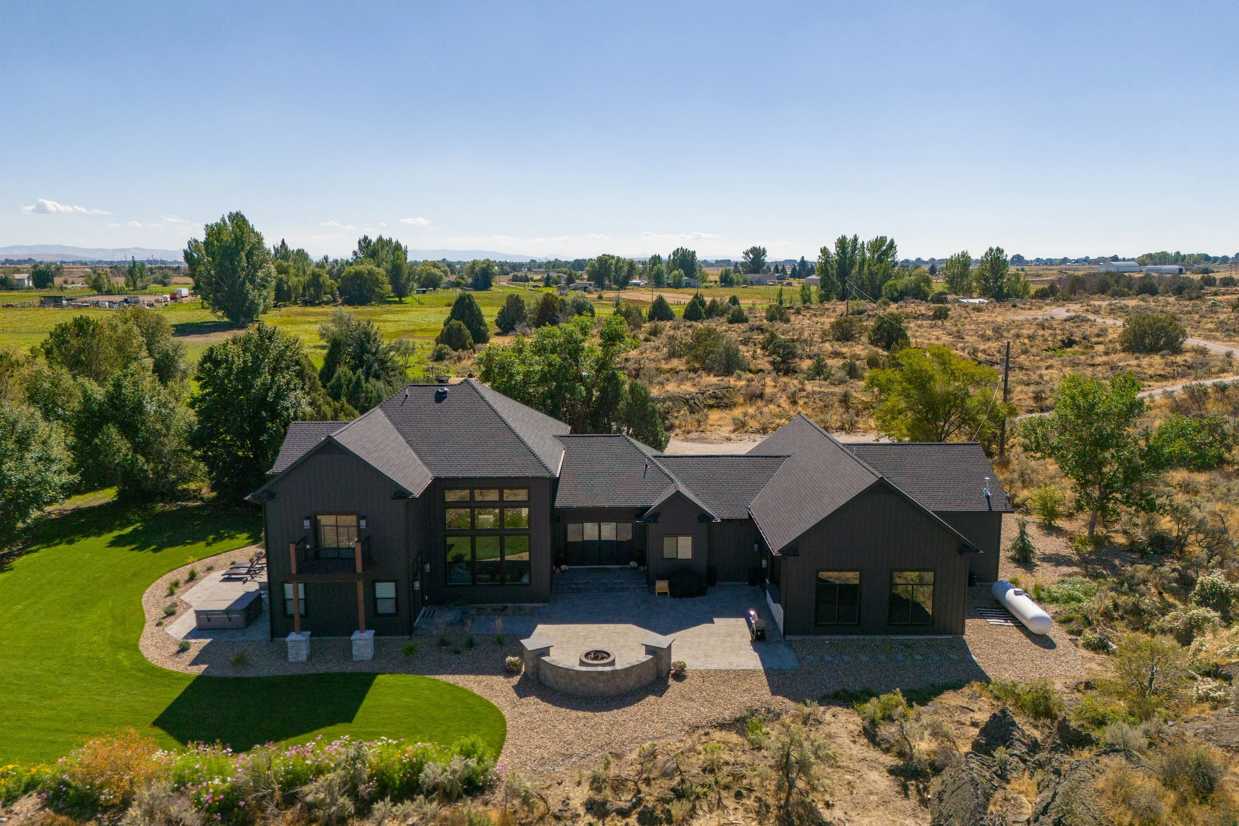 Aerial view of the home and landscaped property — JAB Construction’s Modern Transitional custom home in Blackfoot, Idaho.