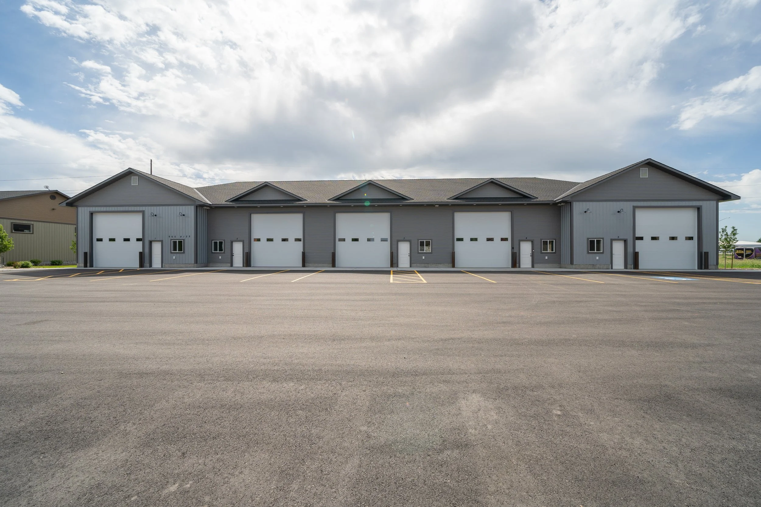 Front view of a row of commercial garage bays — JAB Construction’s Commercial Lease Space project in Rigby, Idaho.