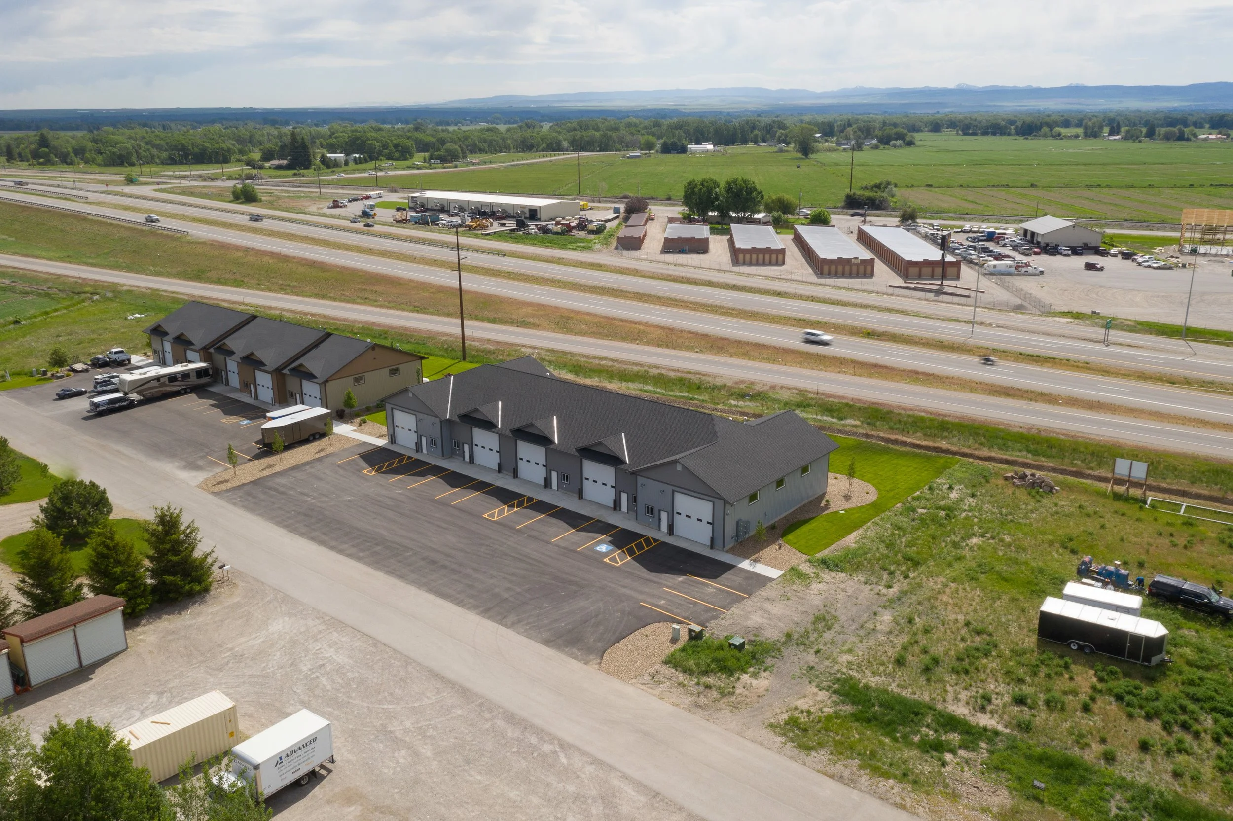 Aerial view of a commercial property and nearby highway — JAB Construction’s Commercial Lease Space project in Rigby, Idaho.