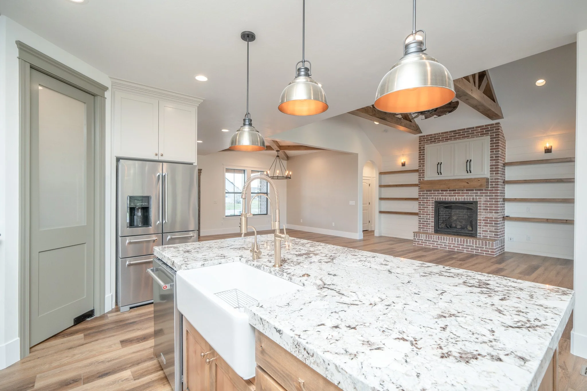 Close view of the kitchen island countertop and pendant lighting — JAB Construction’s Modern Rustic custom home in Idaho Falls, Idaho.