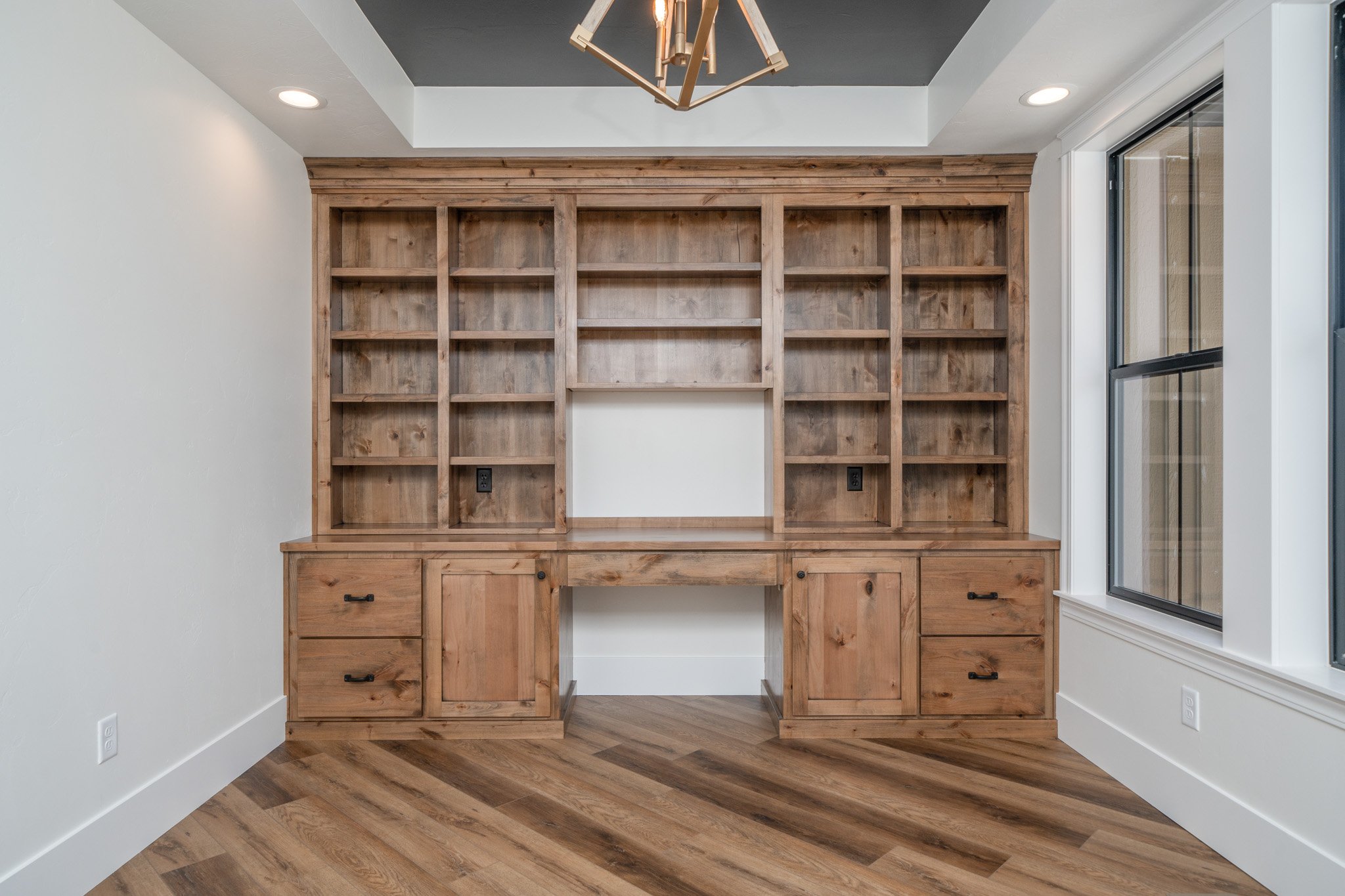 Built-in wood display shelving and storage cabinets — JAB Construction’s Modern Rustic custom home in Idaho Falls, Idaho.