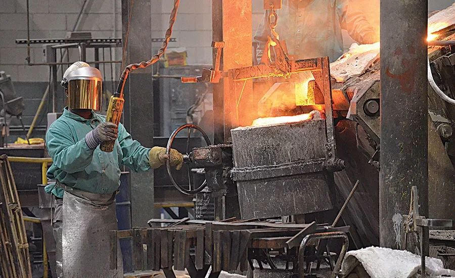 Apollo Valves foundry worker operating industrial casting equipment
