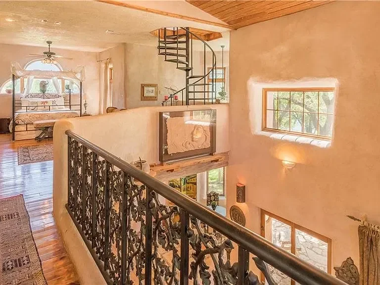 texas-hill-country-luxury-home-spiral-staircase.webp