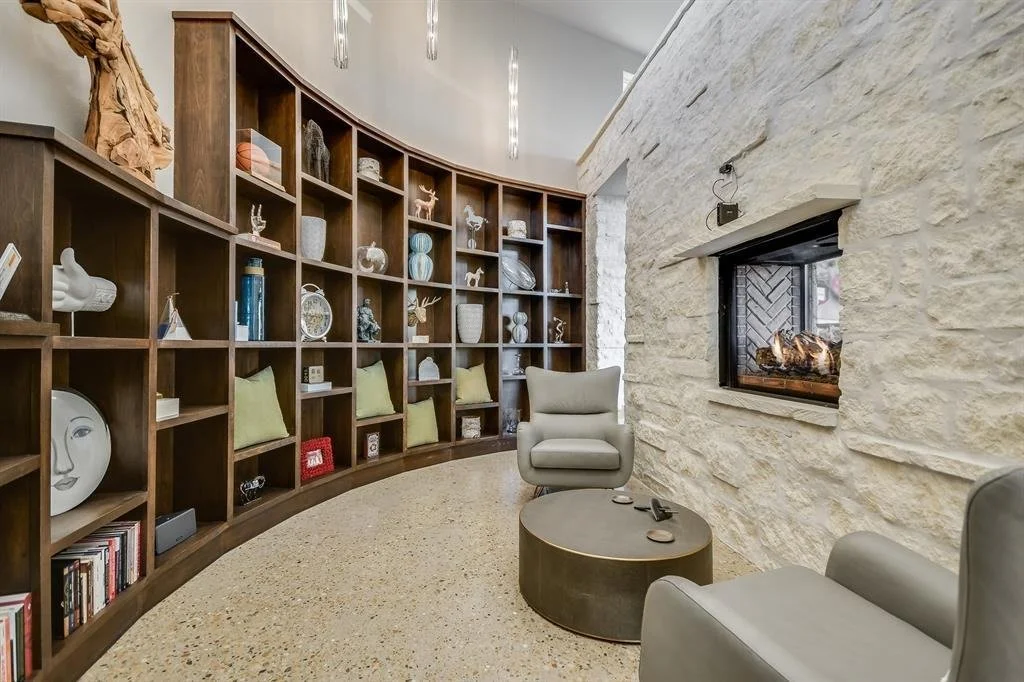 serendipity-residence-curved-wood-bookshelf-fireplace.jpg