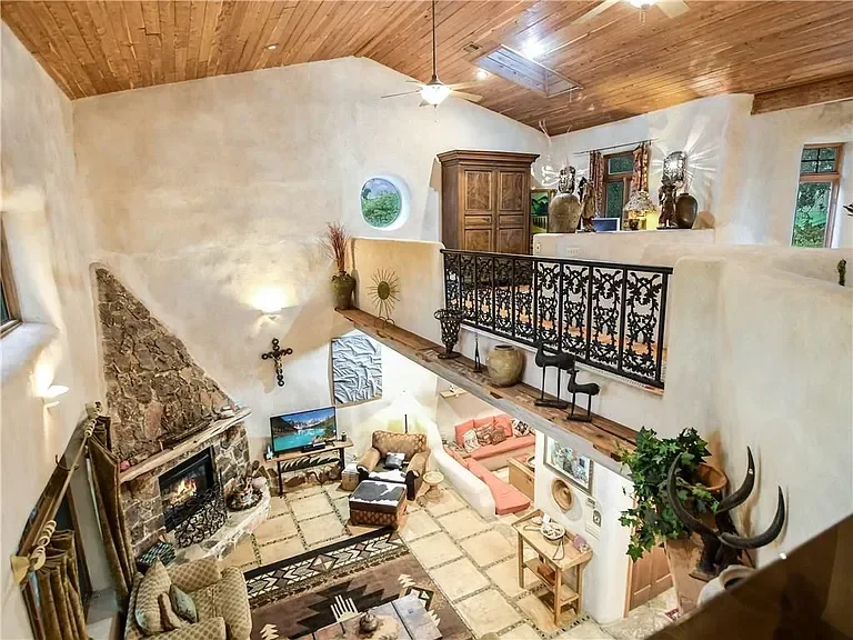 texas-hill-country-living-room-rustic-fireplace.webp
