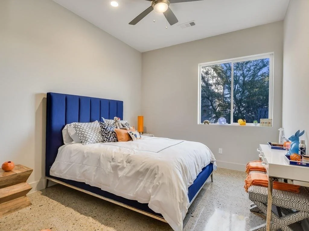 bedroom-blue-upholstered-bed-spicewood-texas.jpg