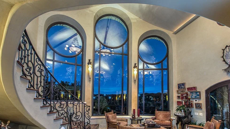 custom-home-architect-austin-curved-staircase-windows.jpg