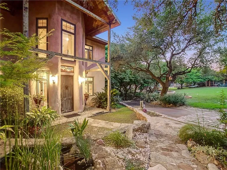 spicewood-texas-hill-country-luxury-rustic-home-exterior.webp