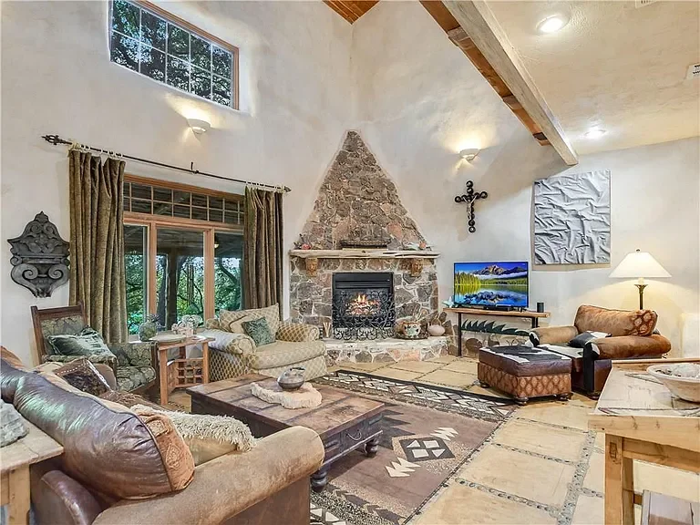 spicewood-living-room-rustic-stone-fireplace-1.webp