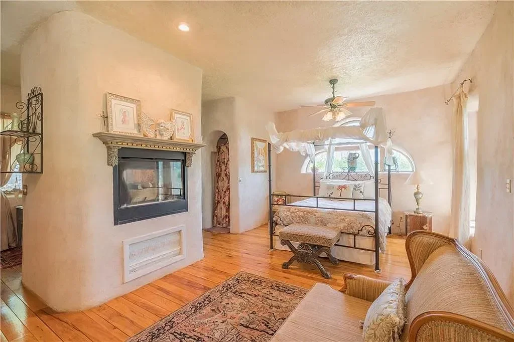 texas-hill-country-bedroom-rustic-fireplace.webp