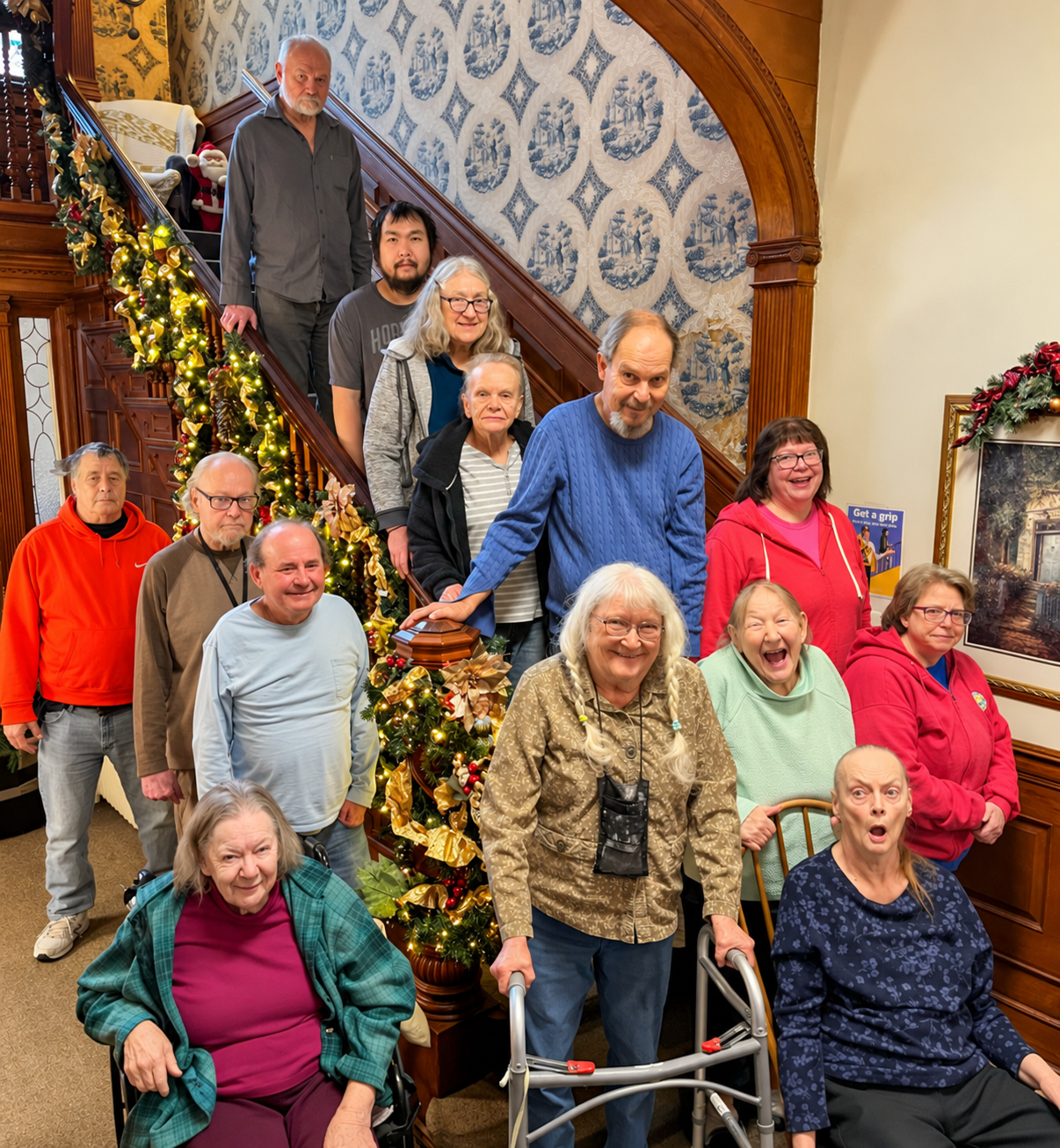 Amy Johnson Residence residents gathered together in their historic St. Paul assisted living home, reflecting the close-knit community for adults living with mental illness.