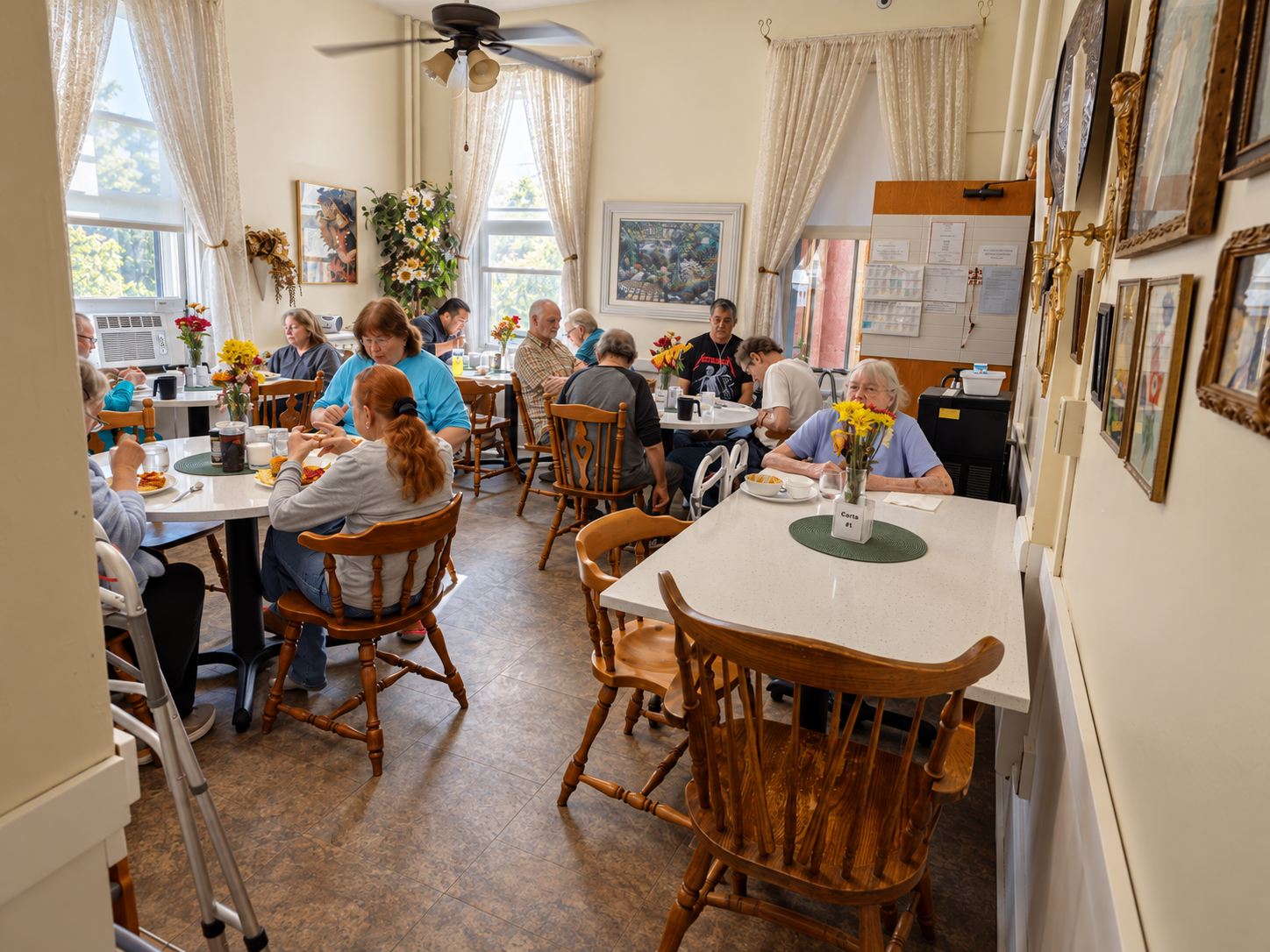 Residents sharing a meal in the dining room at Amy Johnson Residence, a small assisted living community for adults living with mental illness in St. Paul, Minnesota.